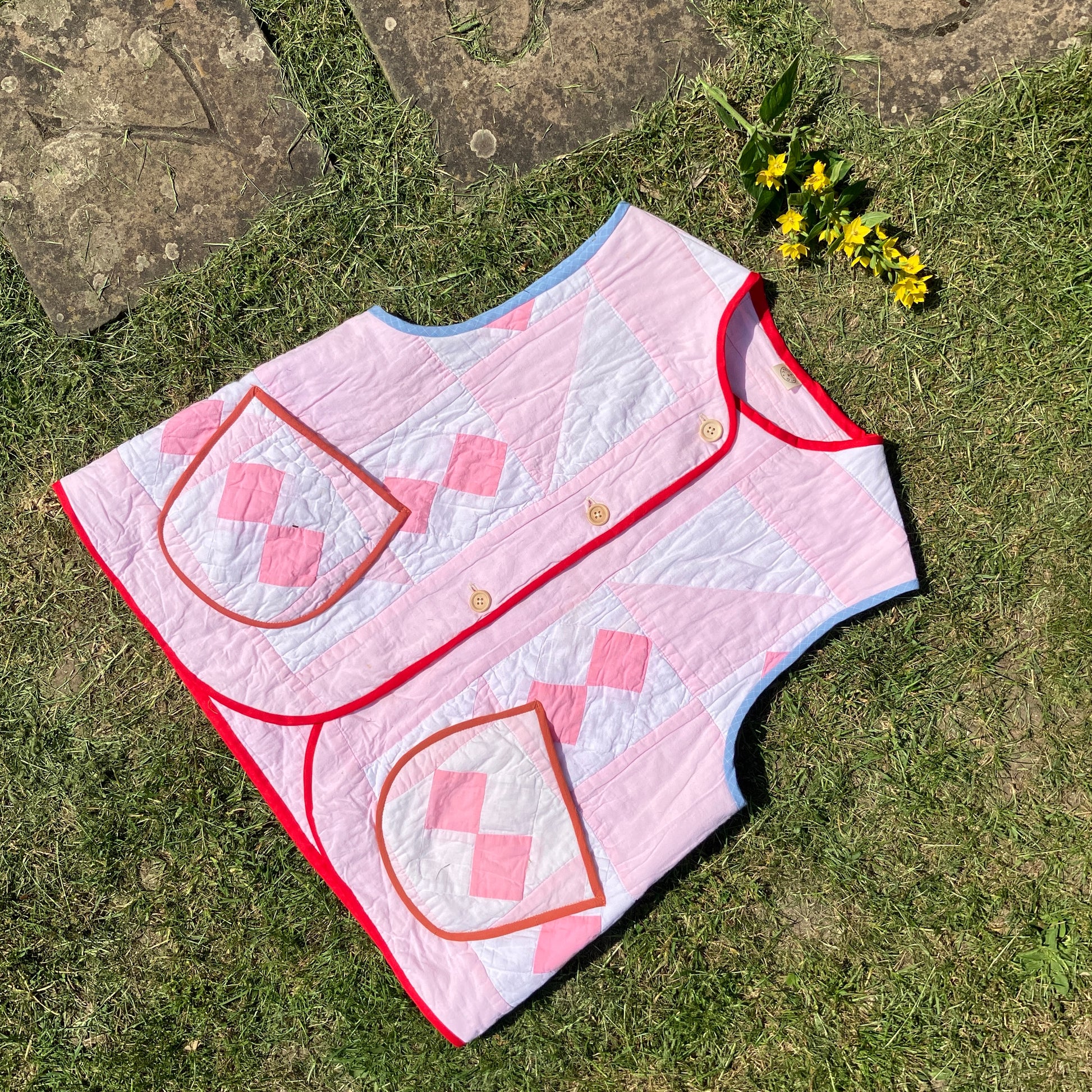 Vest made from a reclaimed pink and white patchwork quilt