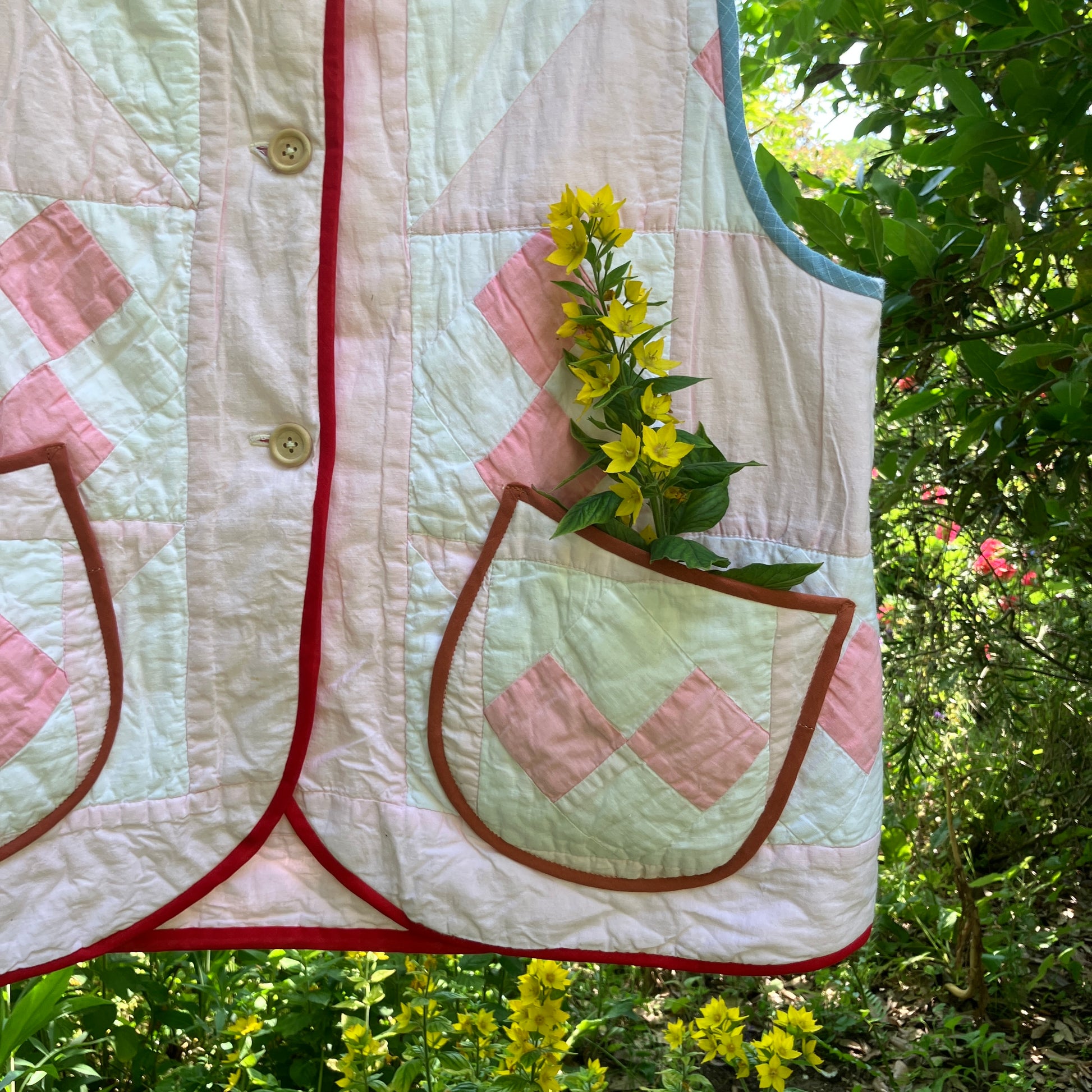 Vest made from a reclaimed pink and white patchwork quilt
