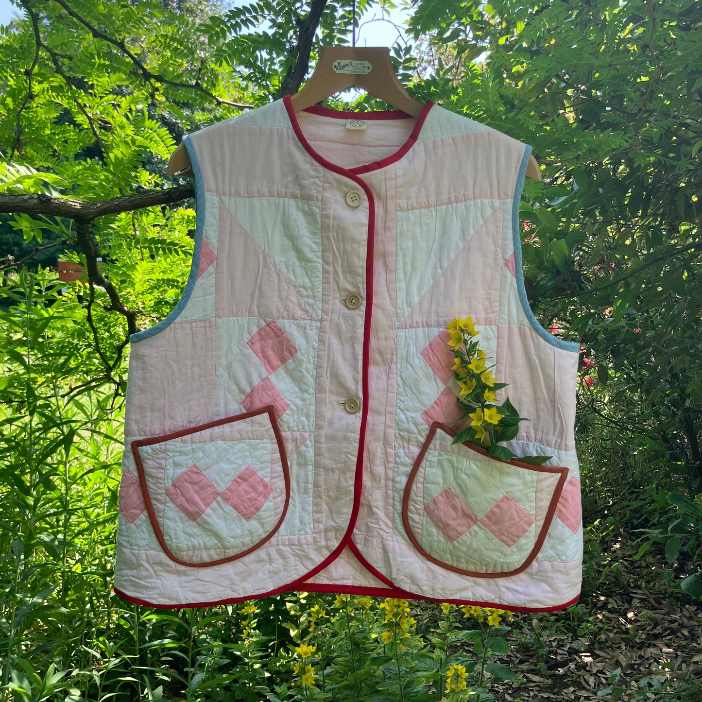 Vest made from a reclaimed pink and white patchwork quilt