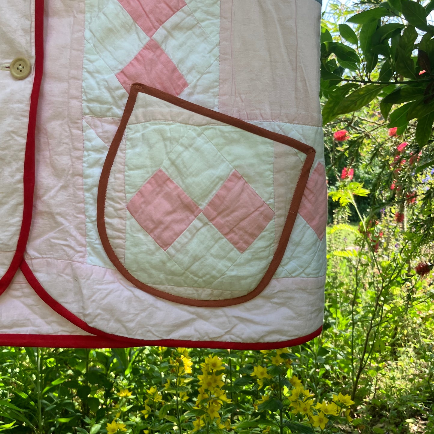 Vest made from a reclaimed pink and white patchwork quilt