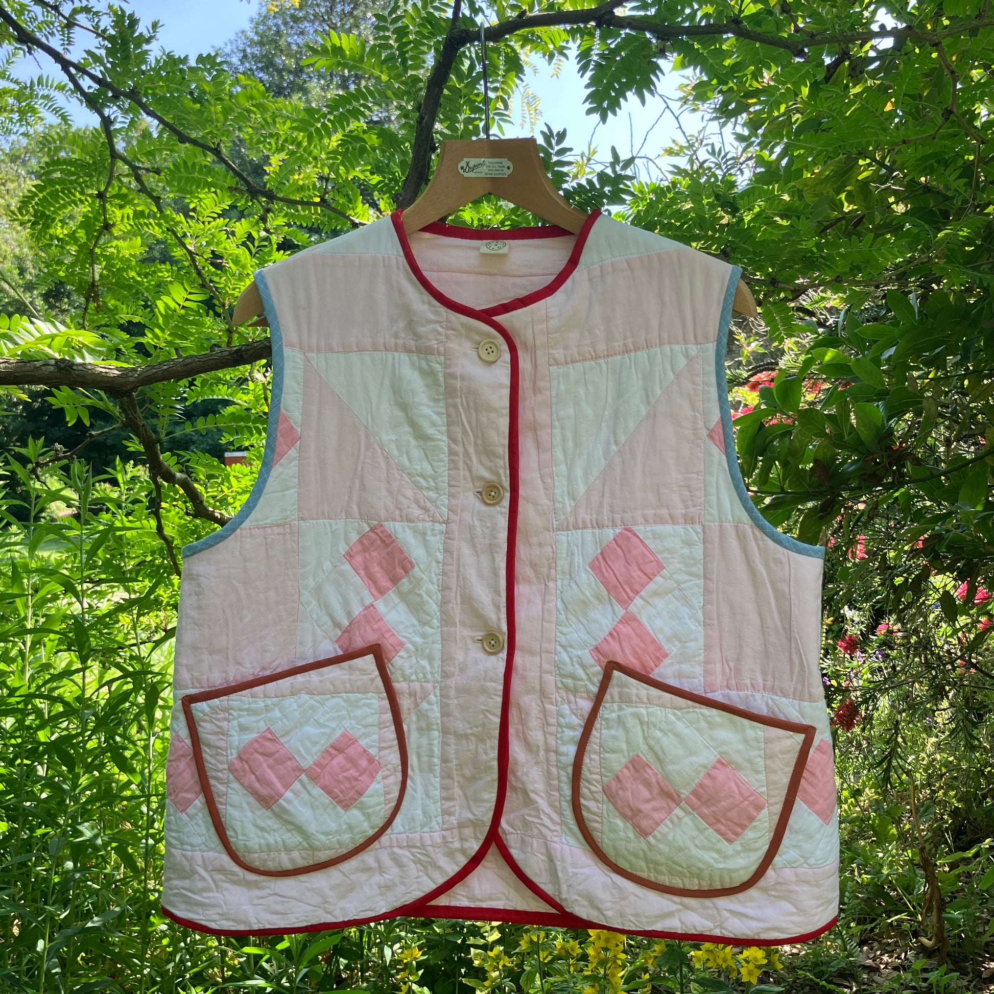 Vest made from a reclaimed pink and white patchwork quilt