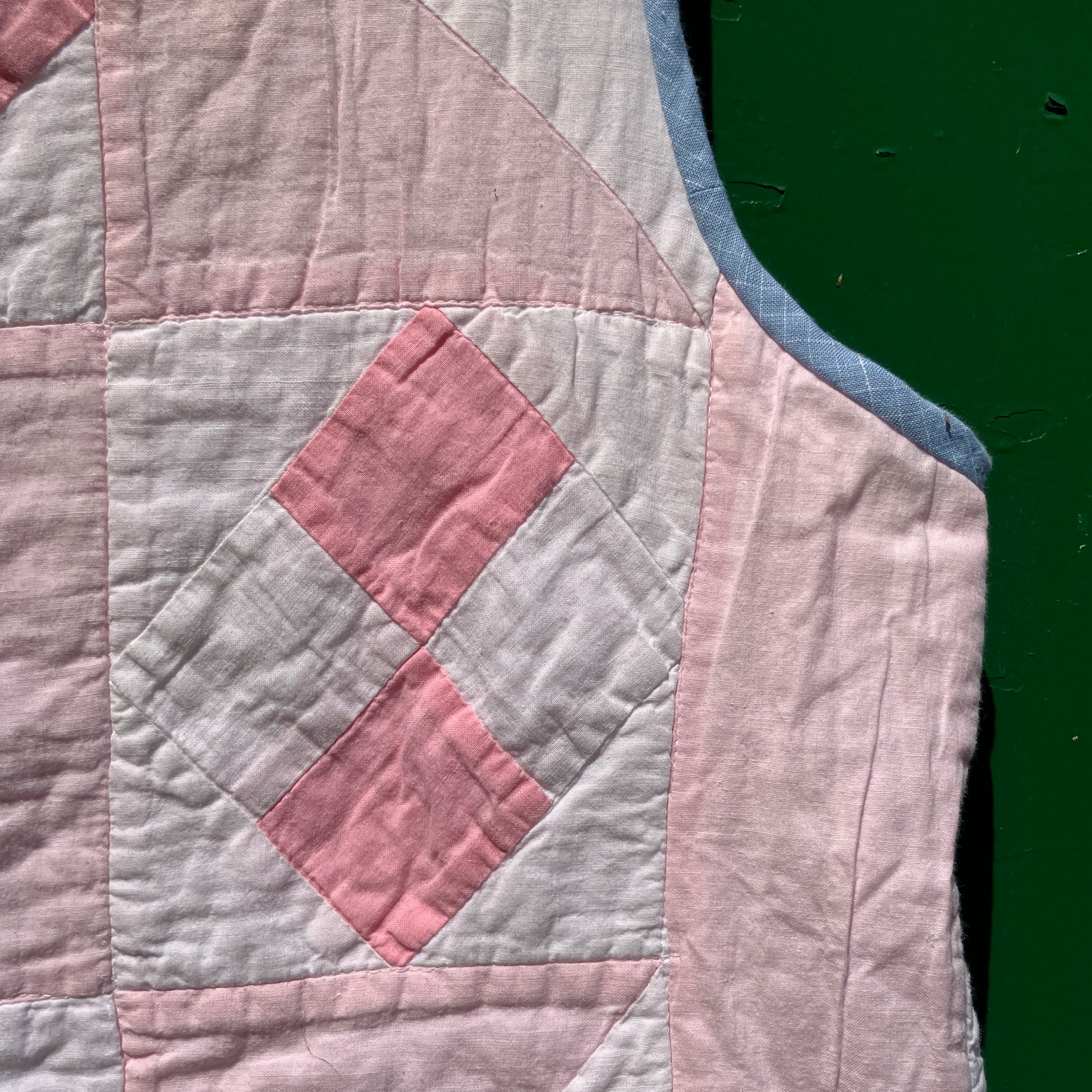 Vest made from a reclaimed pink and white patchwork quilt