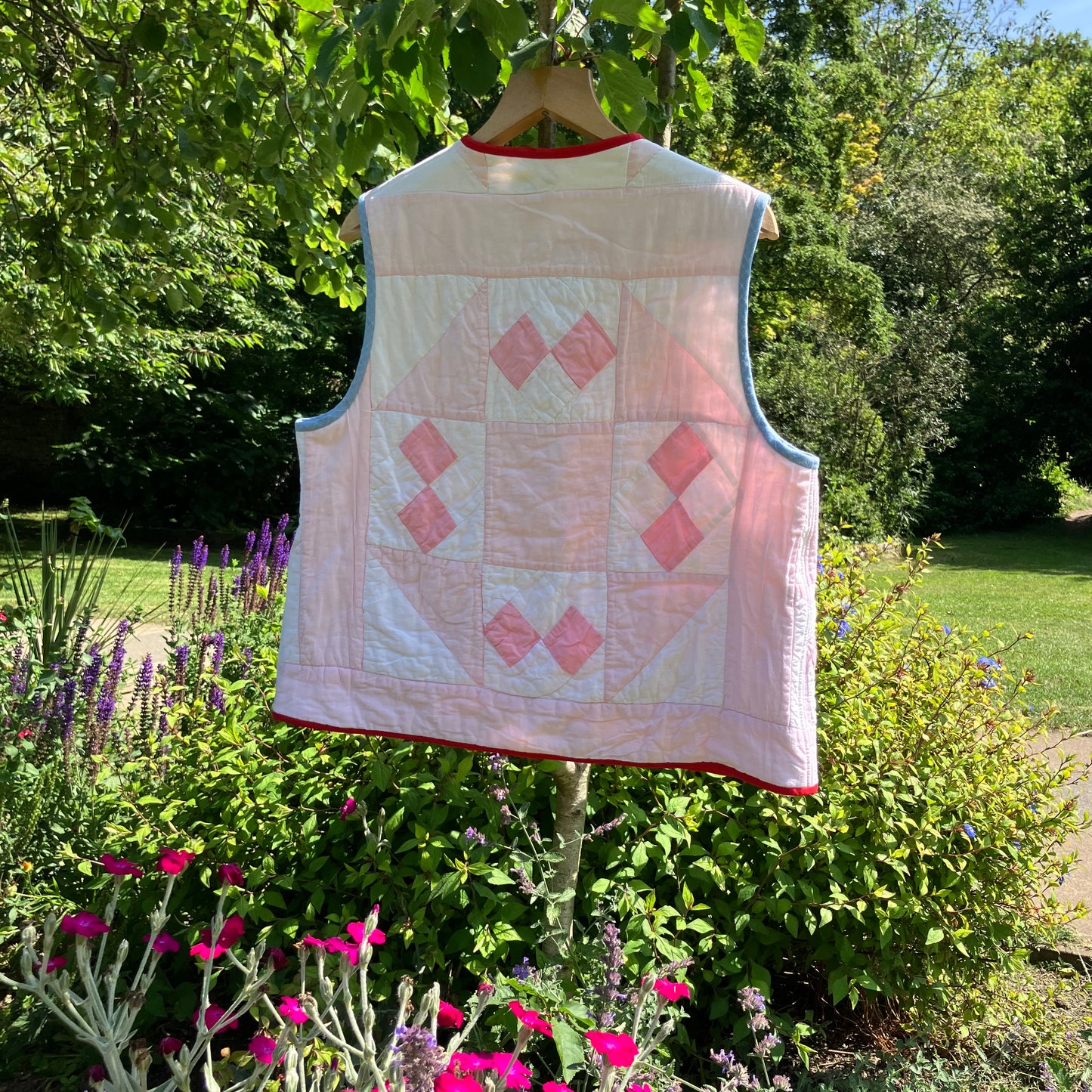 Vest made from a reclaimed pink and white patchwork quilt
