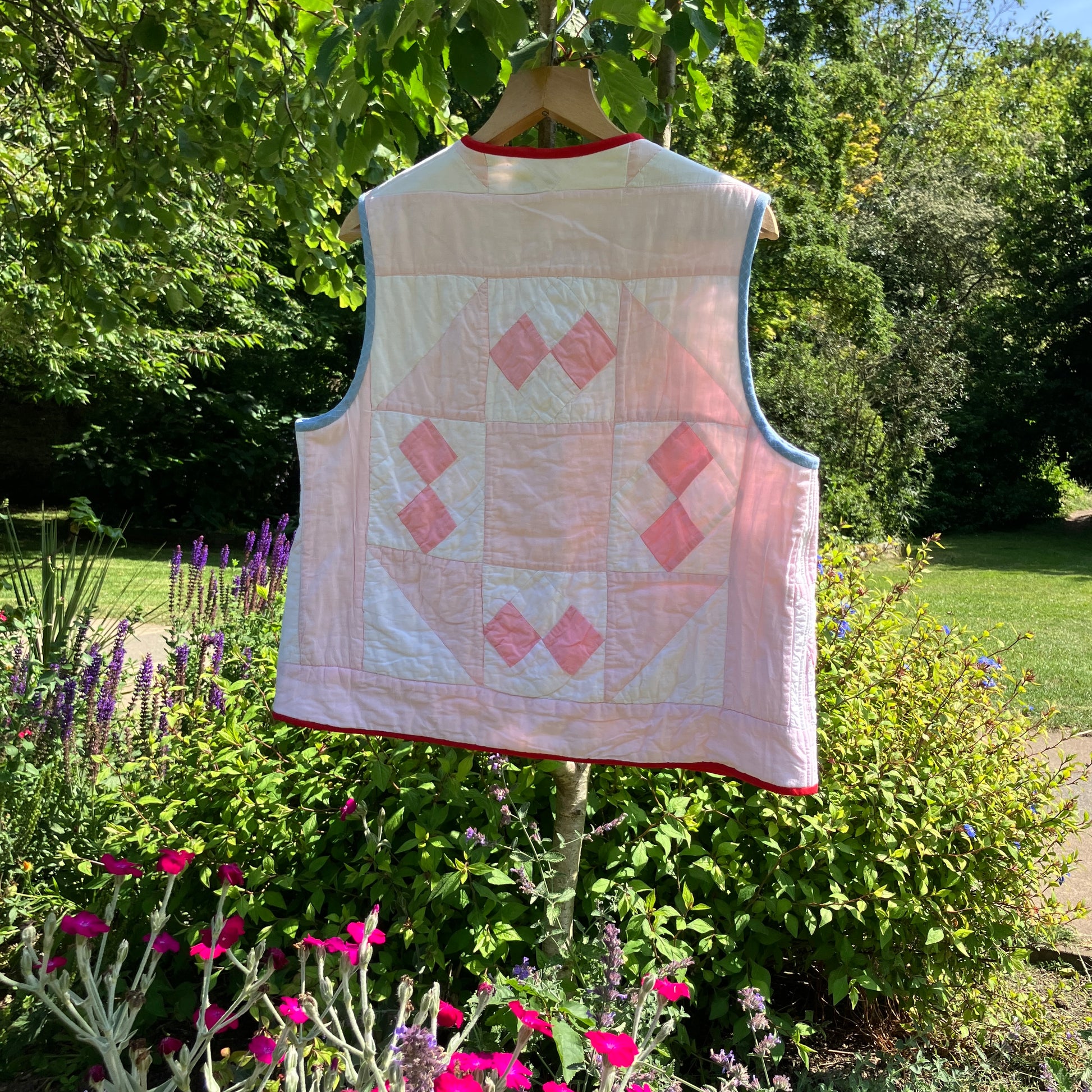 Vest made from a reclaimed pink and white patchwork quilt