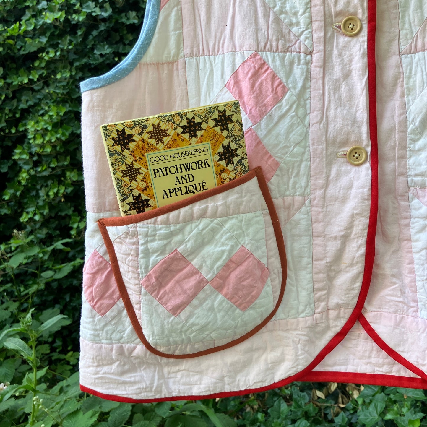 Vest made from a reclaimed pink and white patchwork quilt