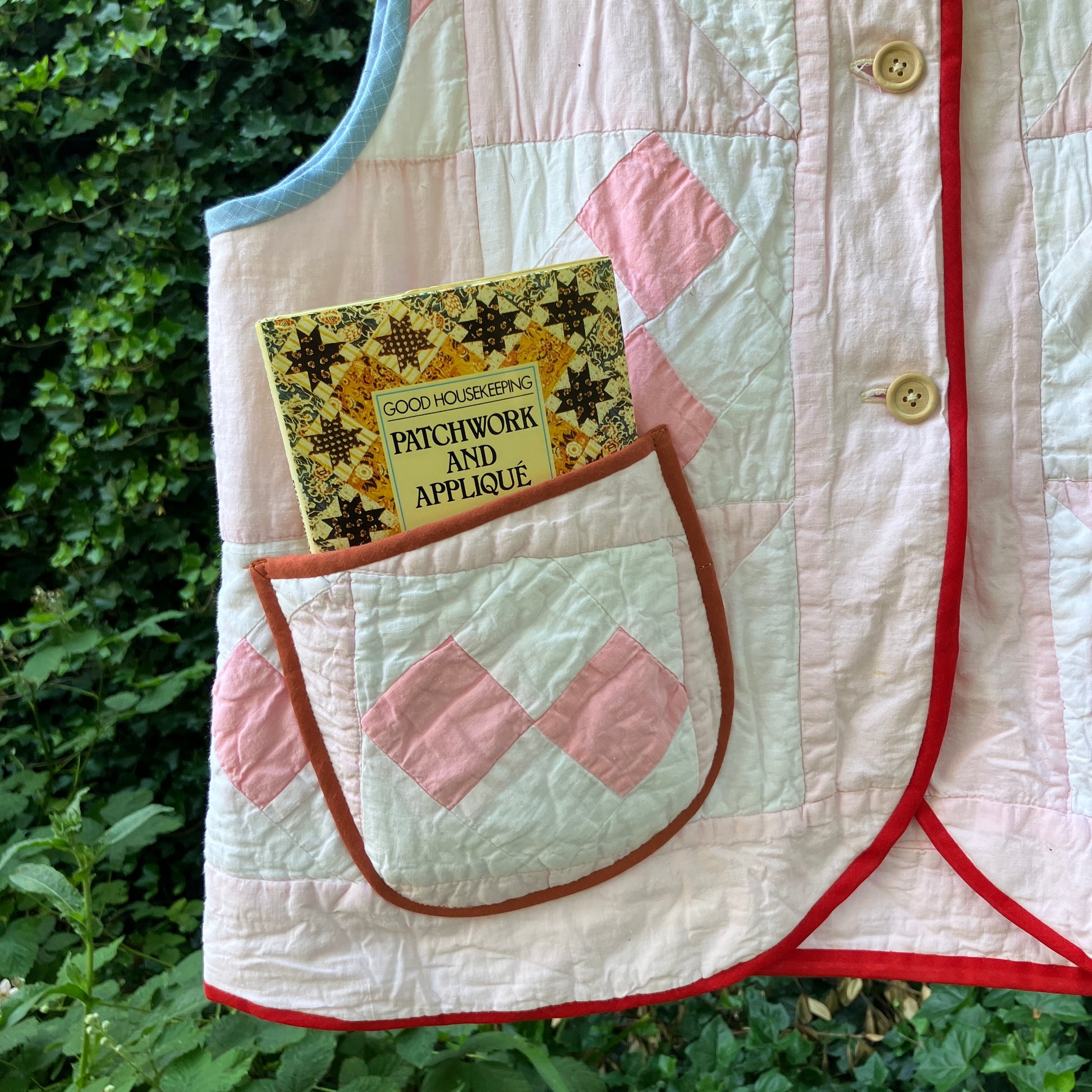 Vest made from a reclaimed pink and white patchwork quilt