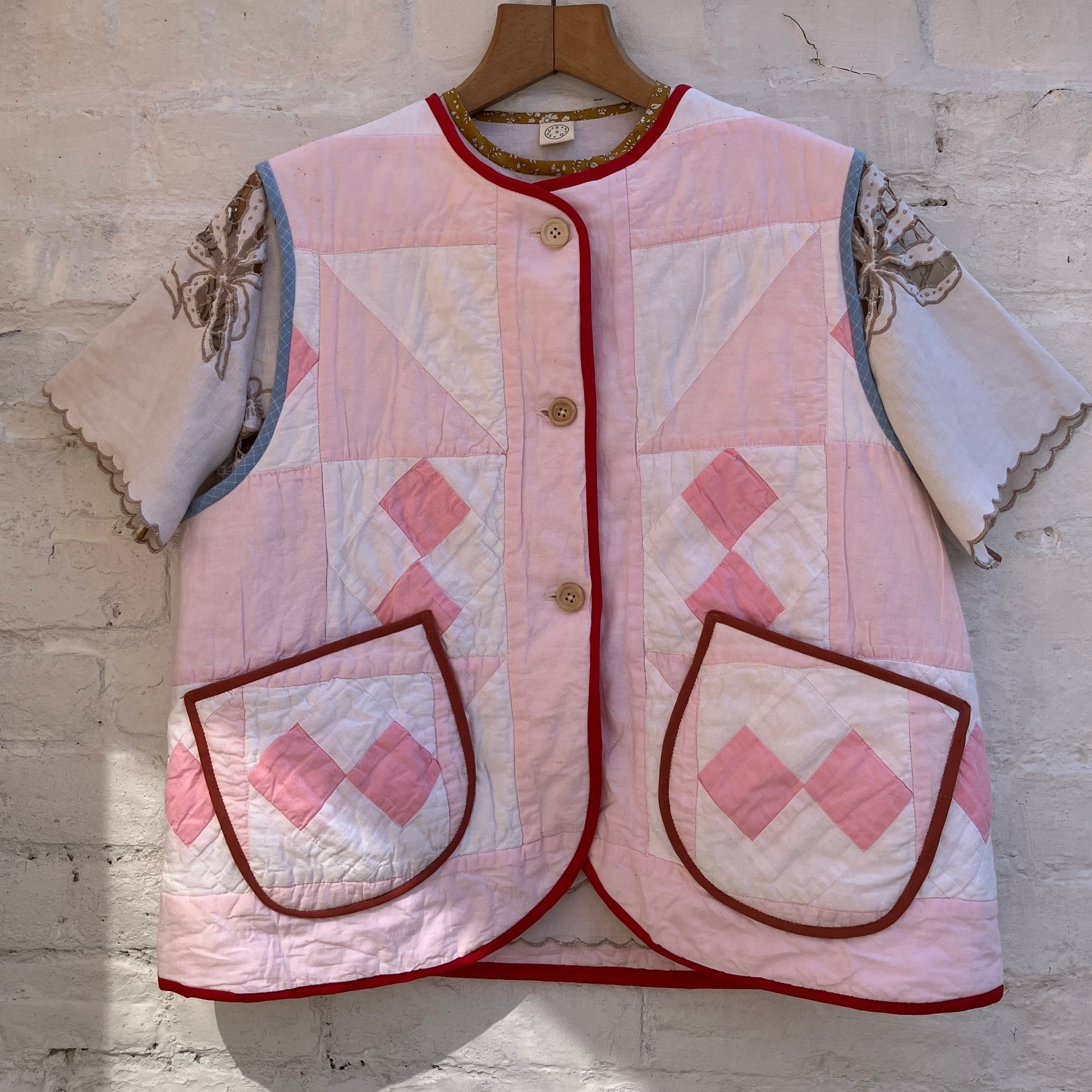 Vest made from a reclaimed pink and white patchwork quilt