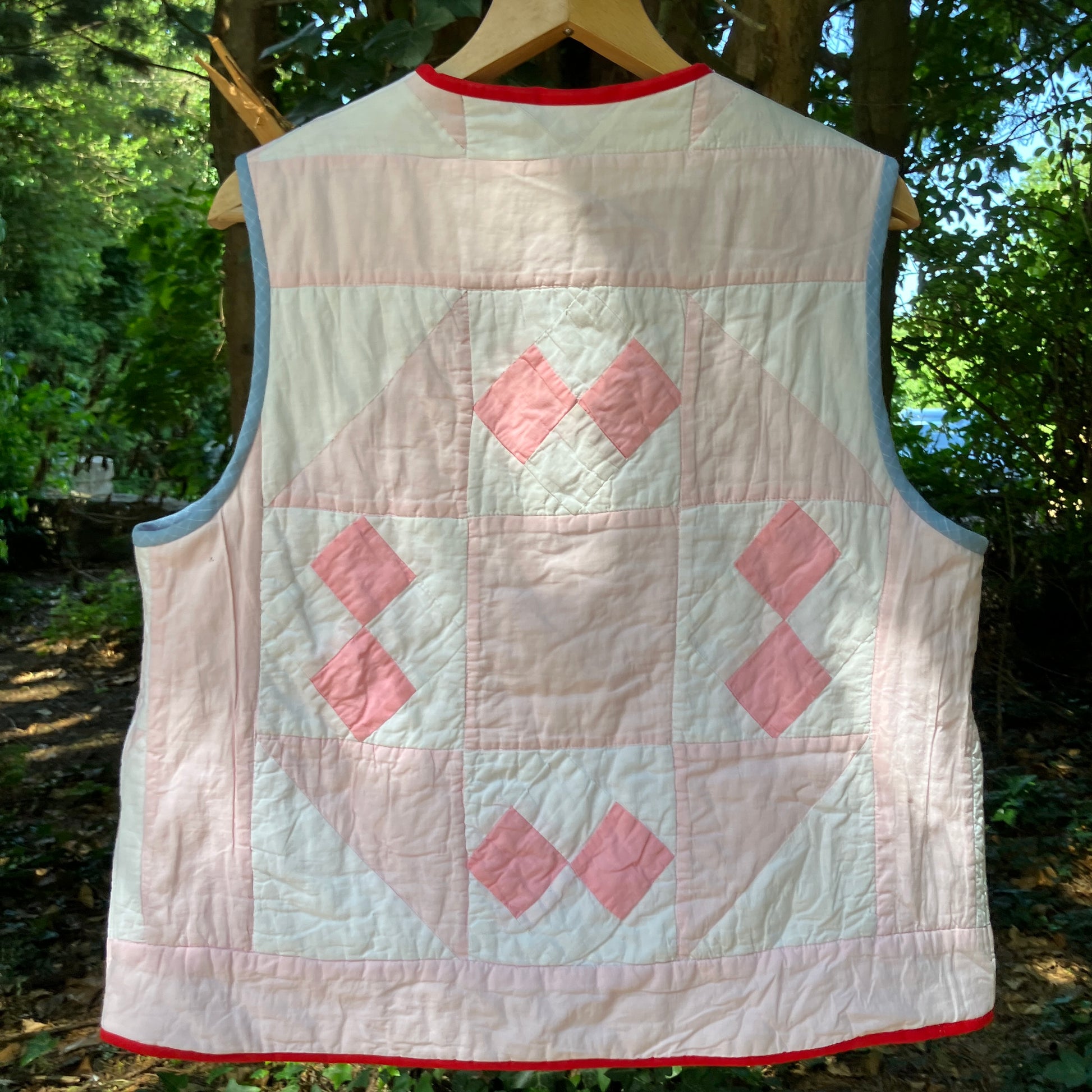 Vest made from a reclaimed pink and white patchwork quilt