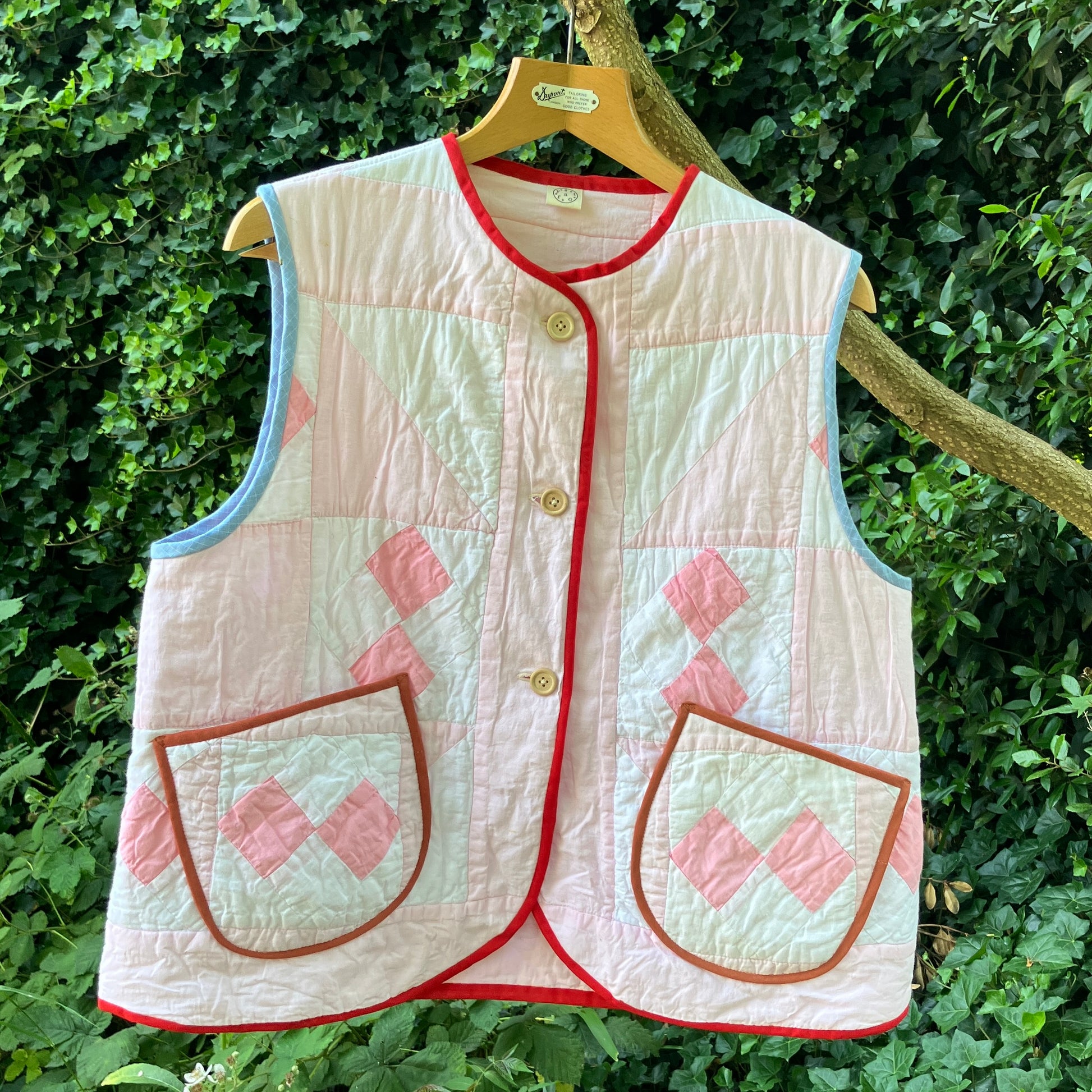 Vest made from a reclaimed pink and white patchwork quilt