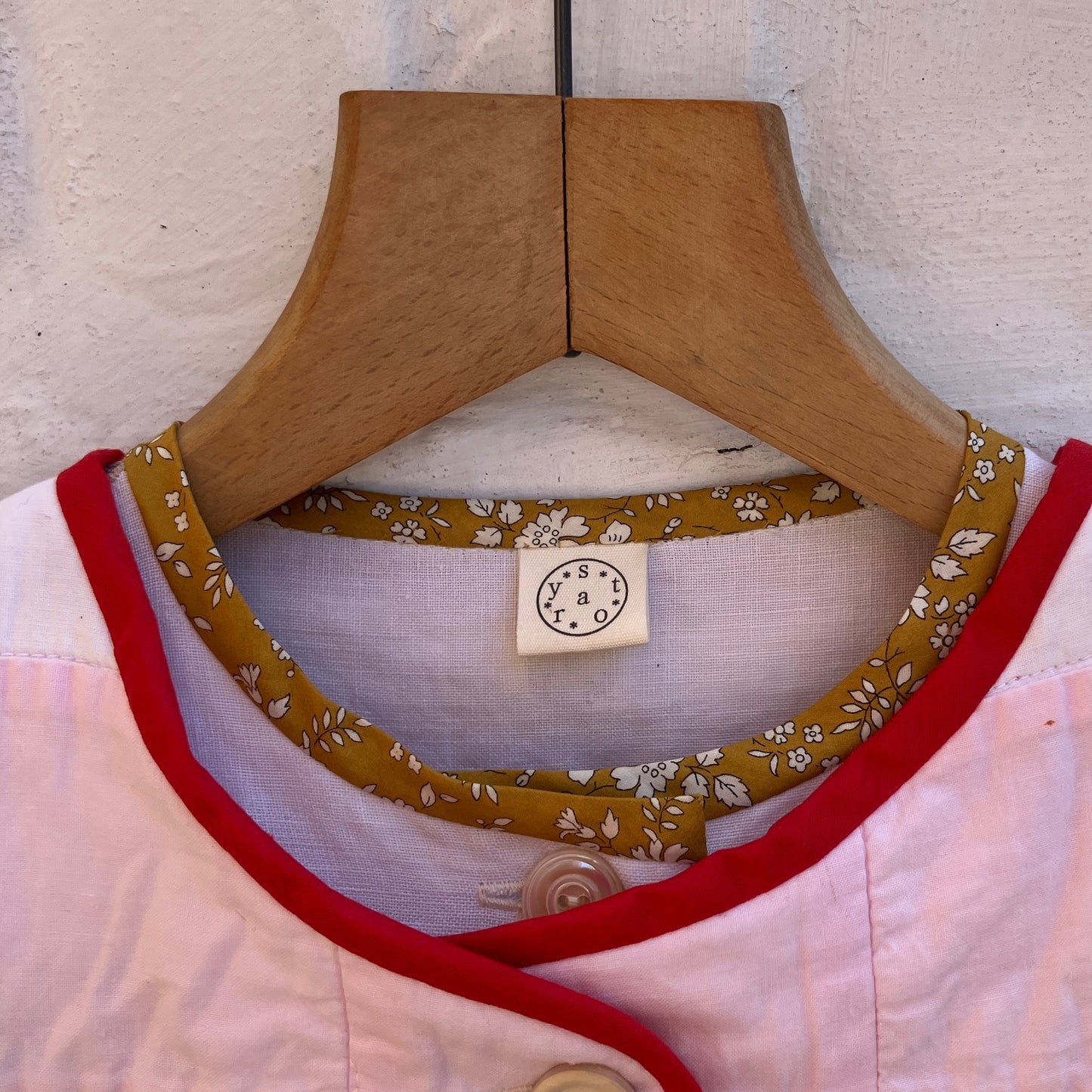 Vest made from a reclaimed pink and white patchwork quilt