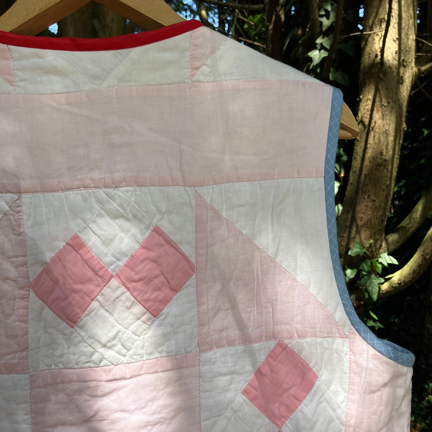 Vest made from a reclaimed pink and white patchwork quilt