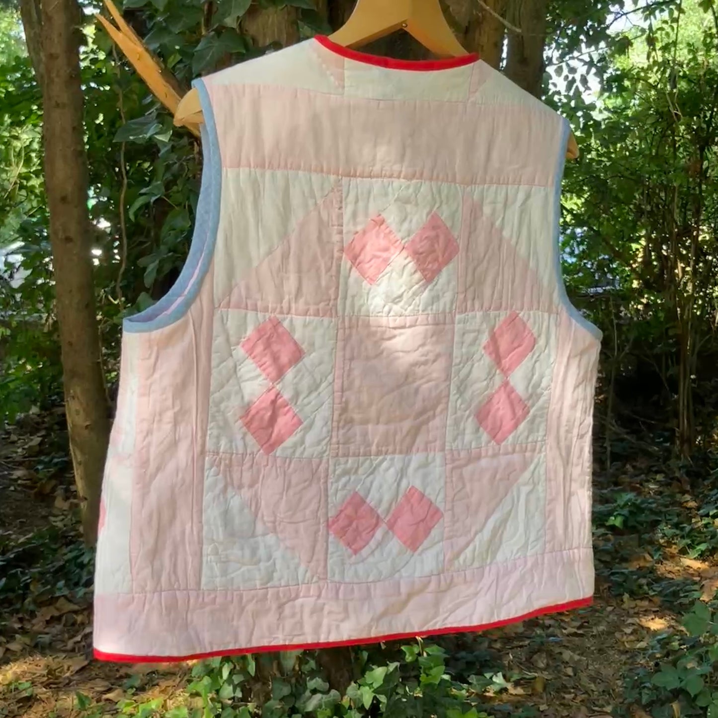 Vest made from a reclaimed pink and white patchwork quilt