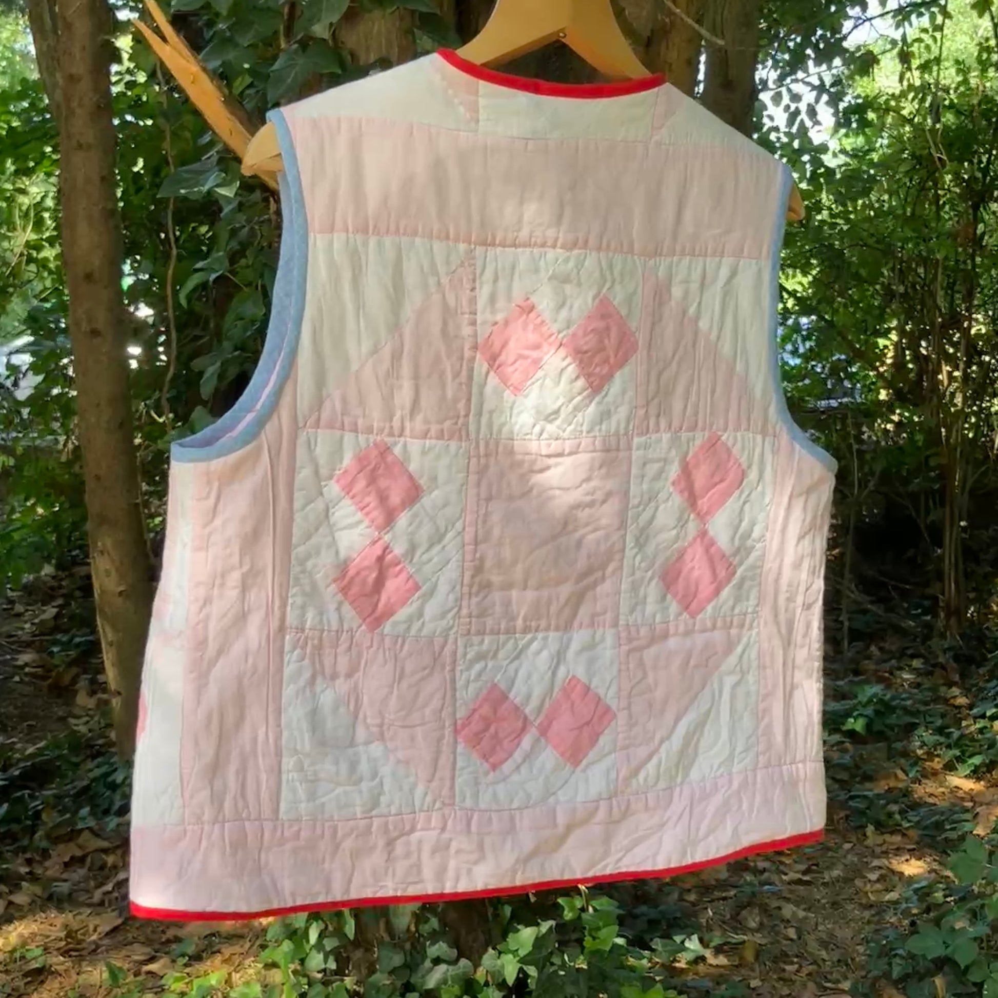Vest made from a reclaimed pink and white patchwork quilt