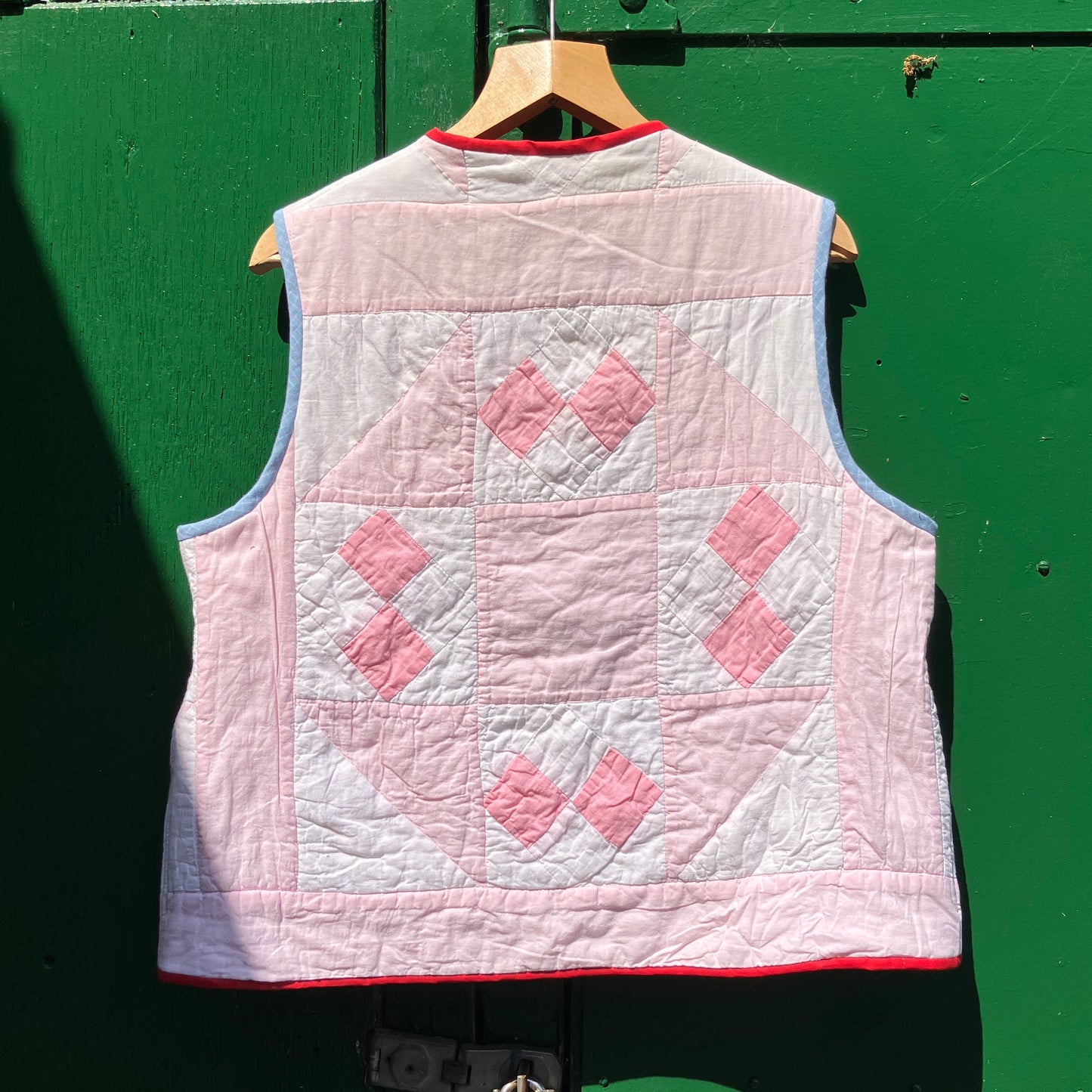 Vest made from a reclaimed pink and white patchwork quilt