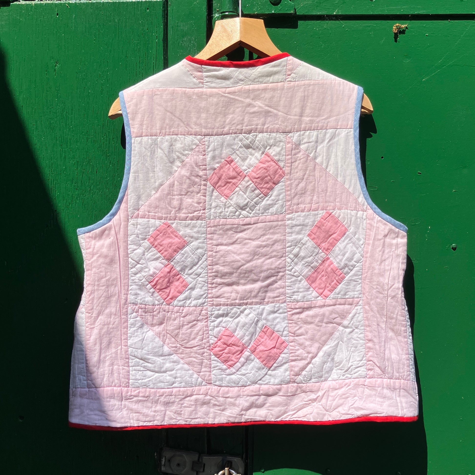 Vest made from a reclaimed pink and white patchwork quilt