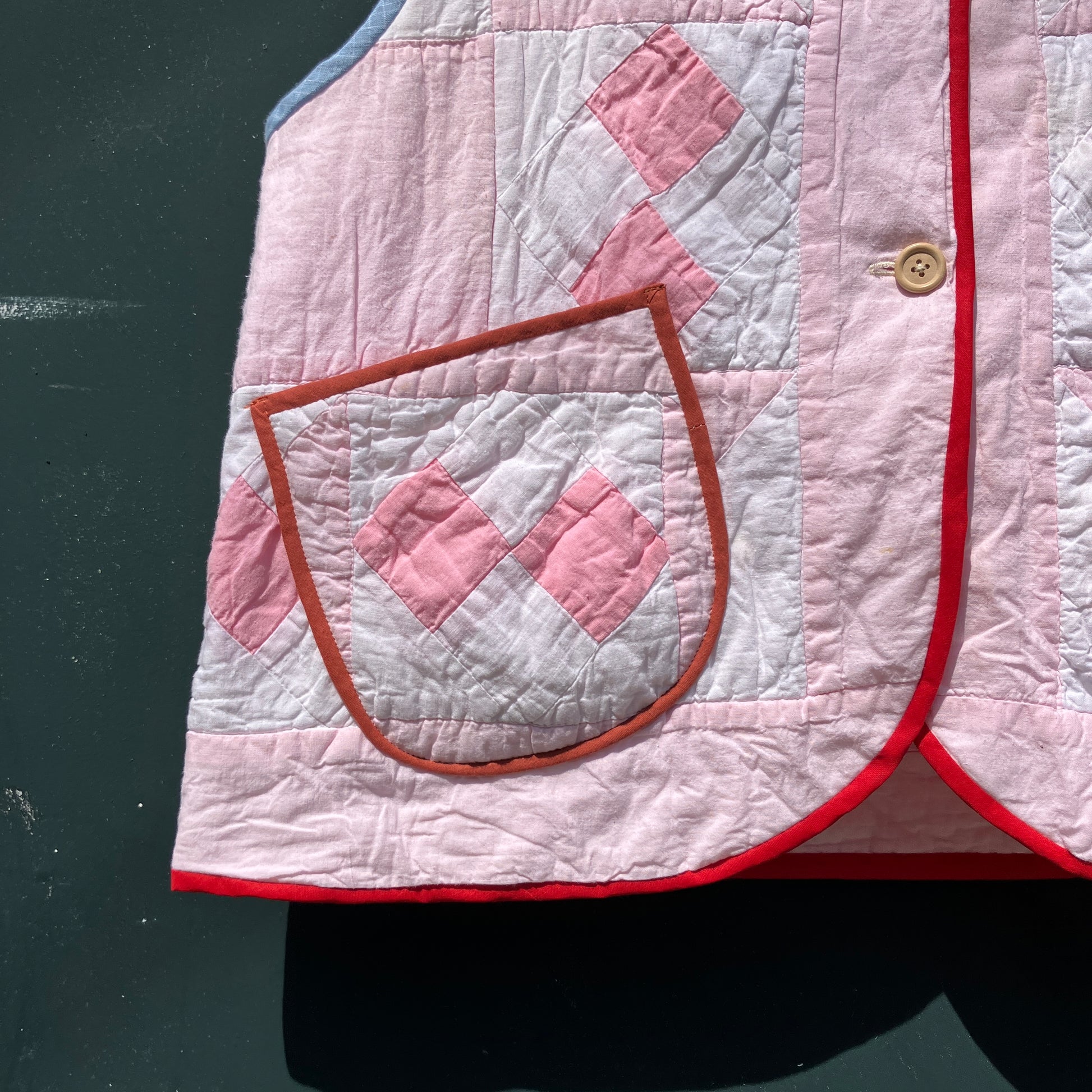 Vest made from a reclaimed pink and white patchwork quilt