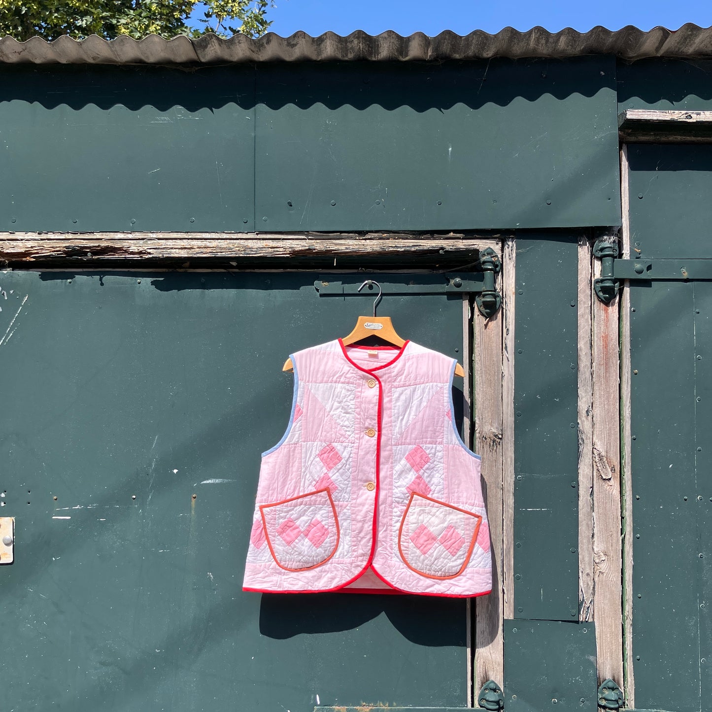 Vest made from a reclaimed pink and white patchwork quilt