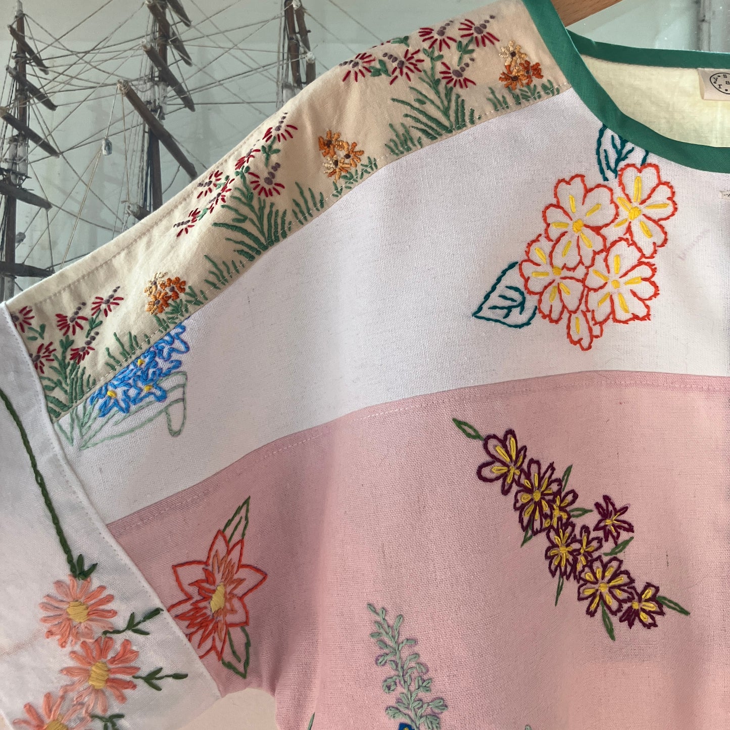 Boxy top made from a patchwork of vintage floral embroidered pastel coloured cotton and linen tablecloths and tray cloths