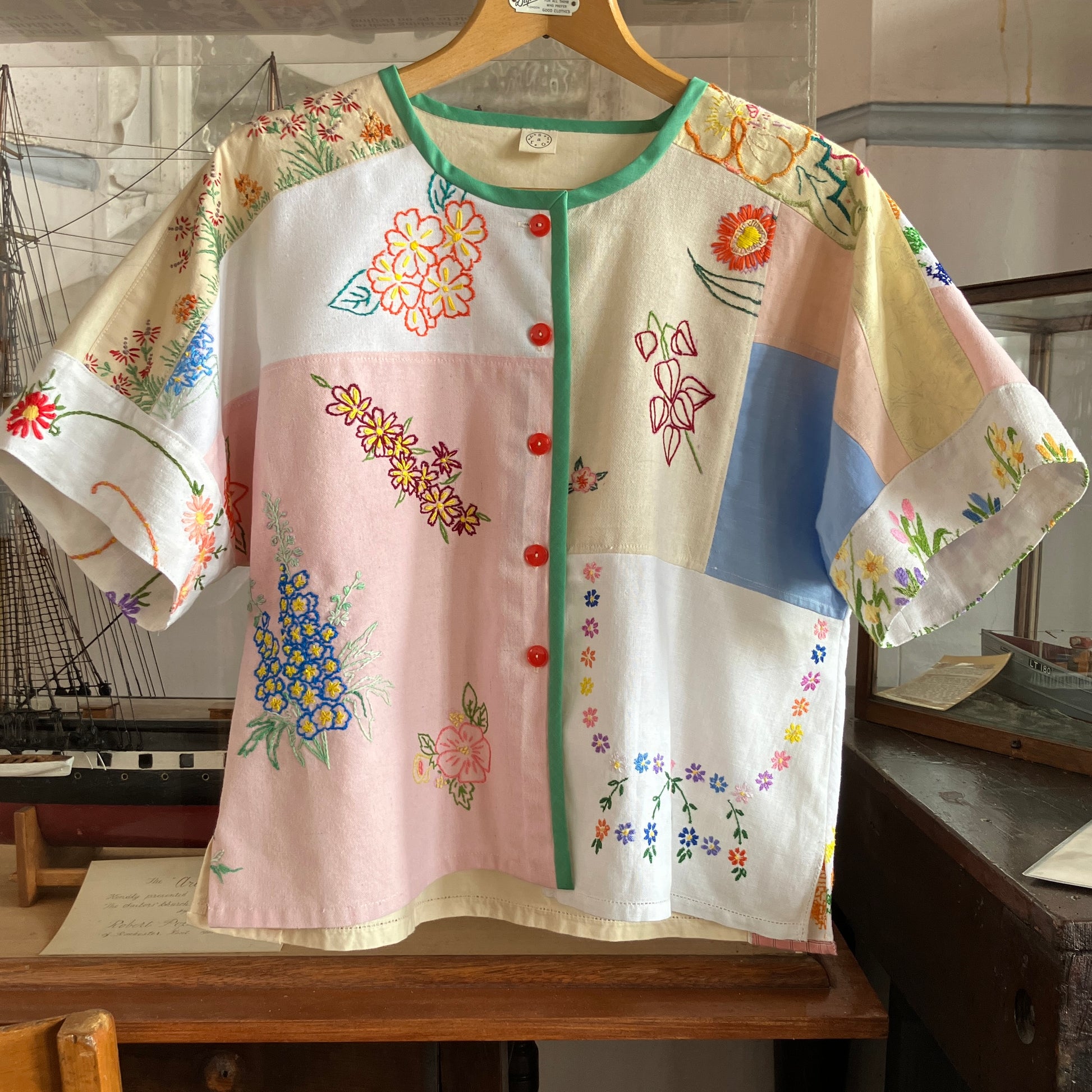 Boxy top made from a patchwork of vintage floral embroidered pastel coloured cotton and linen tablecloths and tray cloths