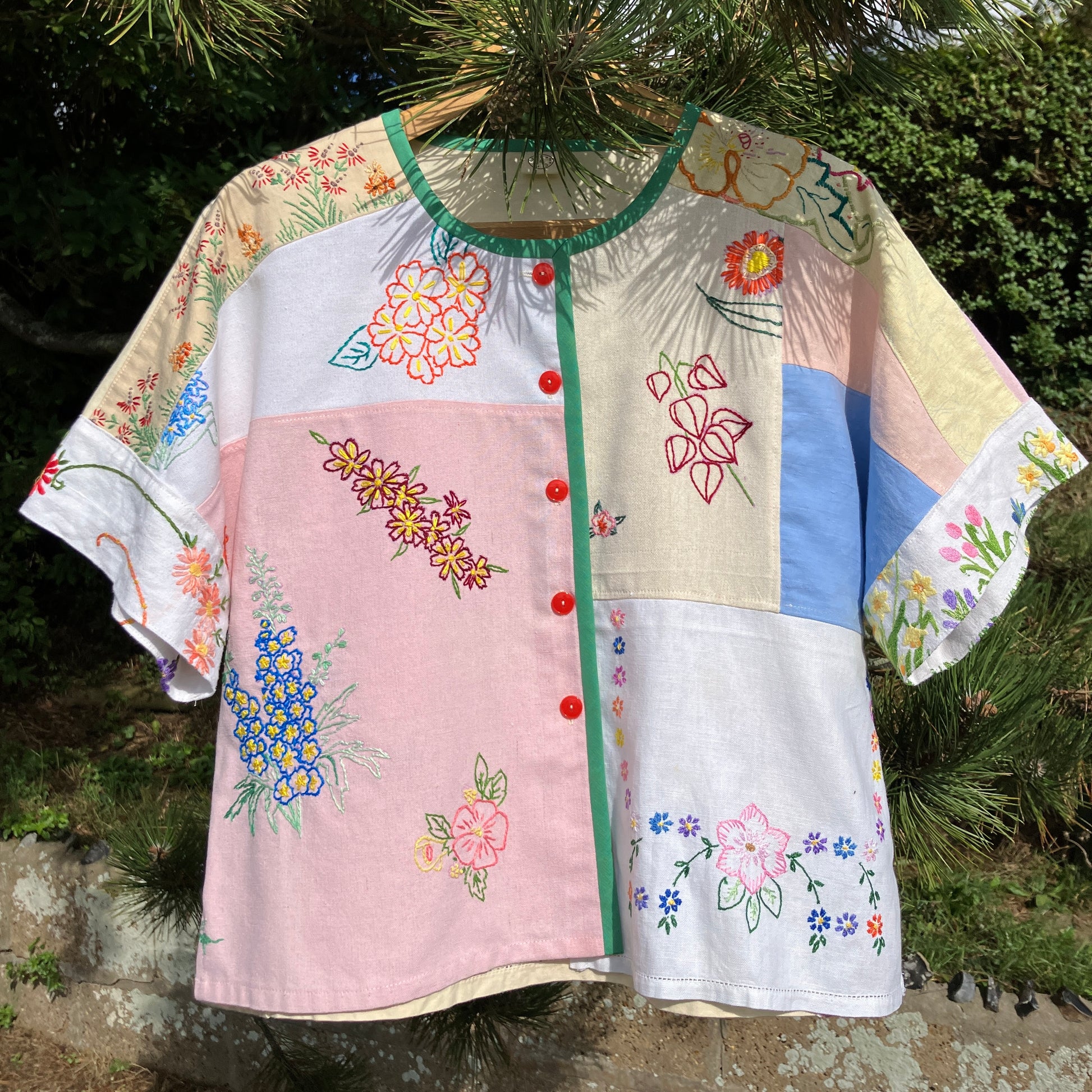 Boxy top made from a patchwork of vintage floral embroidered pastel coloured cotton and linen tablecloths and tray cloths