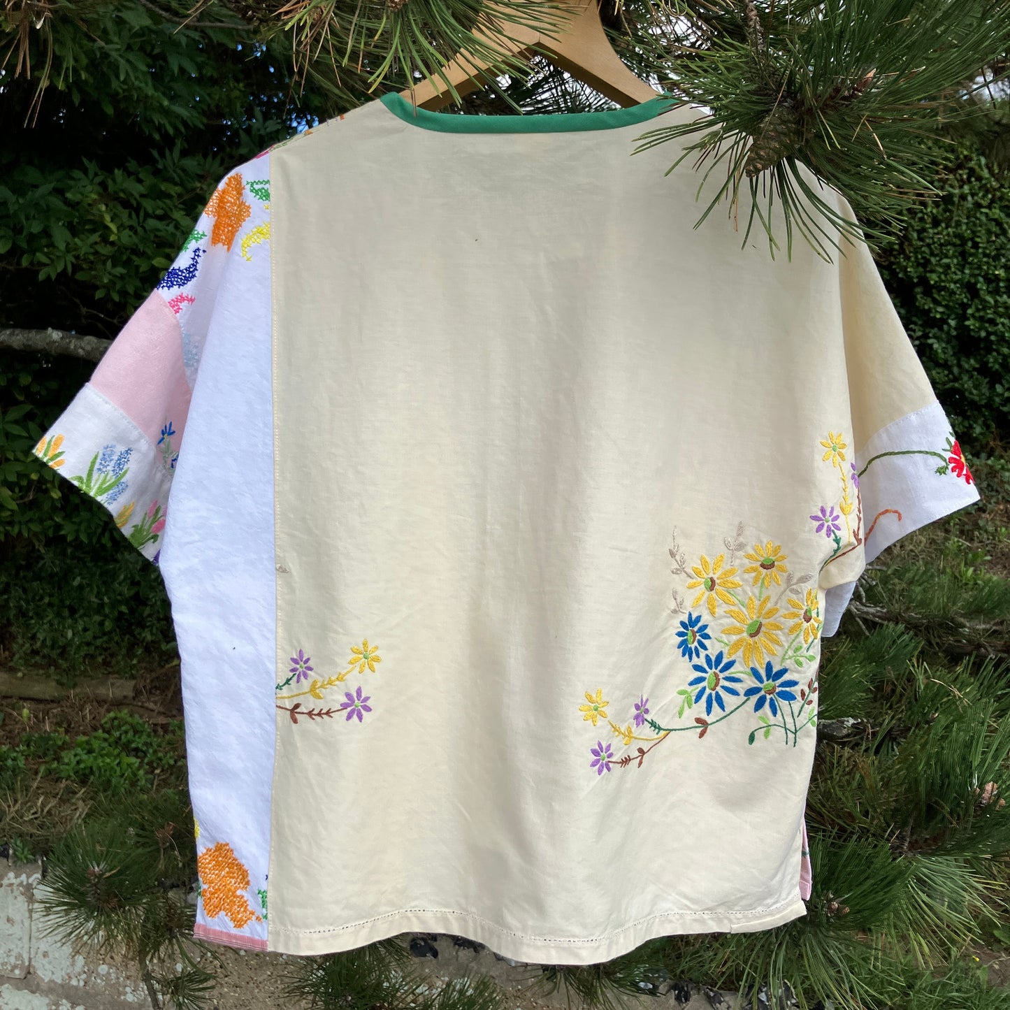 Boxy top made from a patchwork of vintage floral embroidered pastel coloured cotton and linen tablecloths and tray cloths