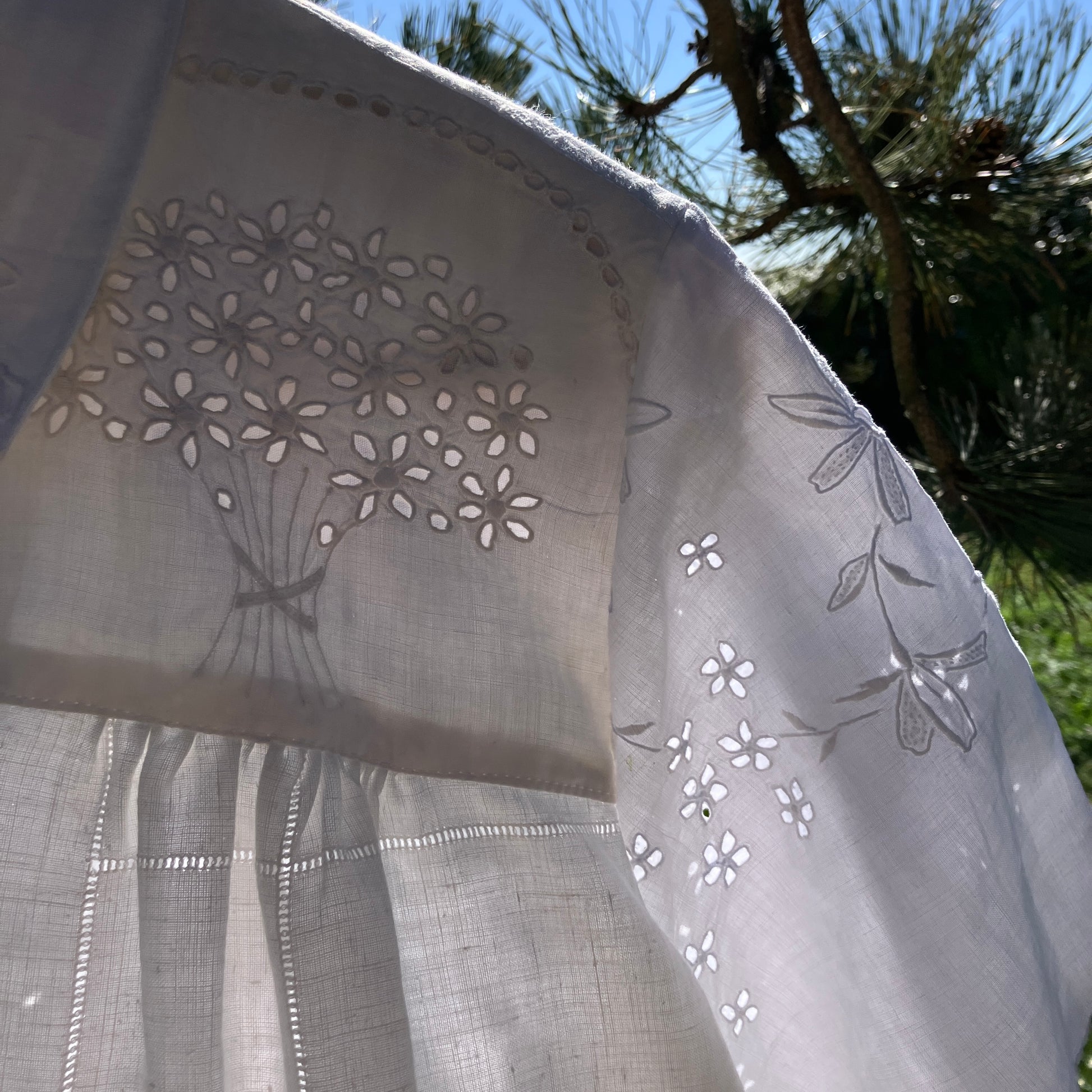 pretty, breezy blouse made from a 
patchwork of reclaimed vintage cotton and linen white cutwork tablecloths.
