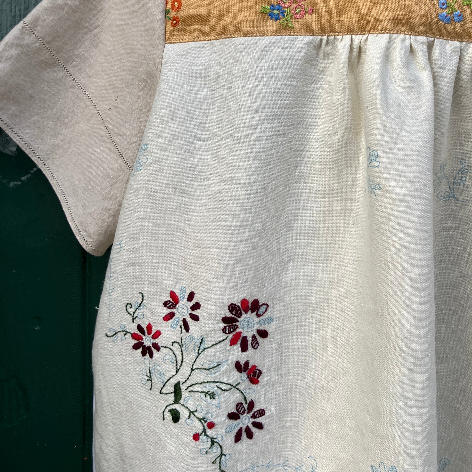 Recycled fabric shirt with embroidery depicting a village pub