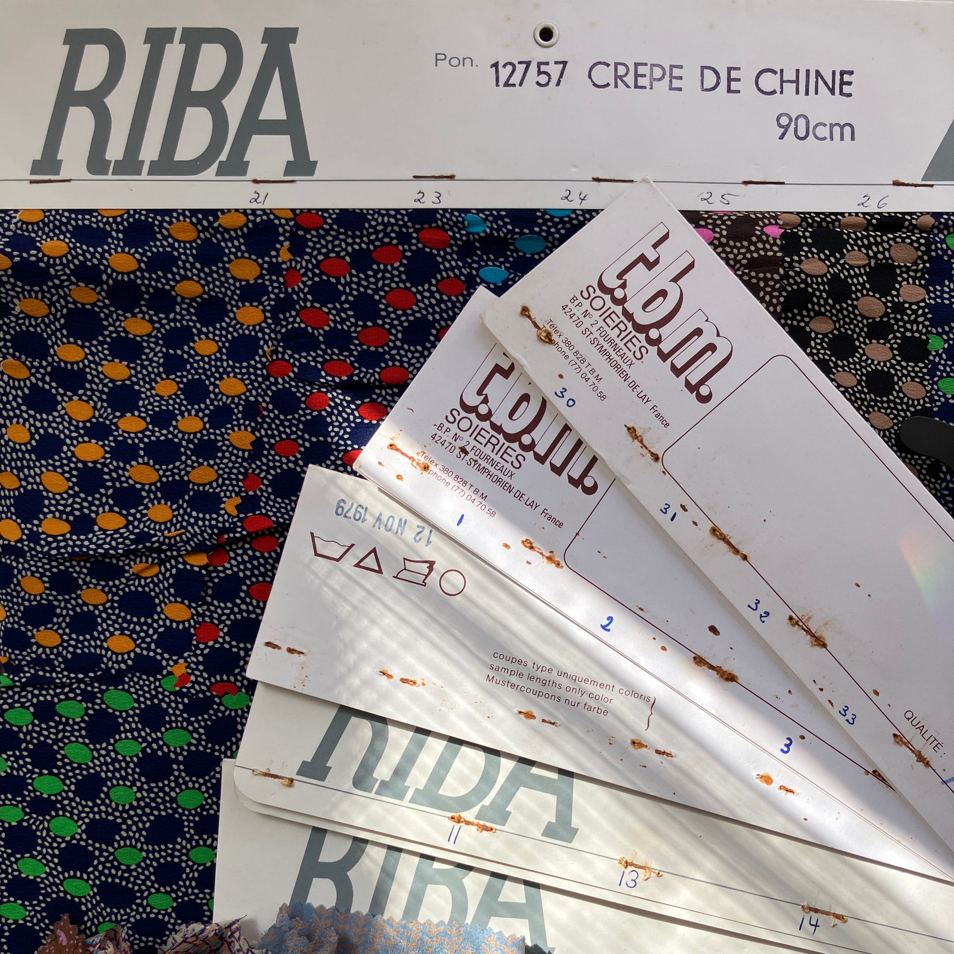 RIBA fabric silk 70s swatches with a patterned fabric background