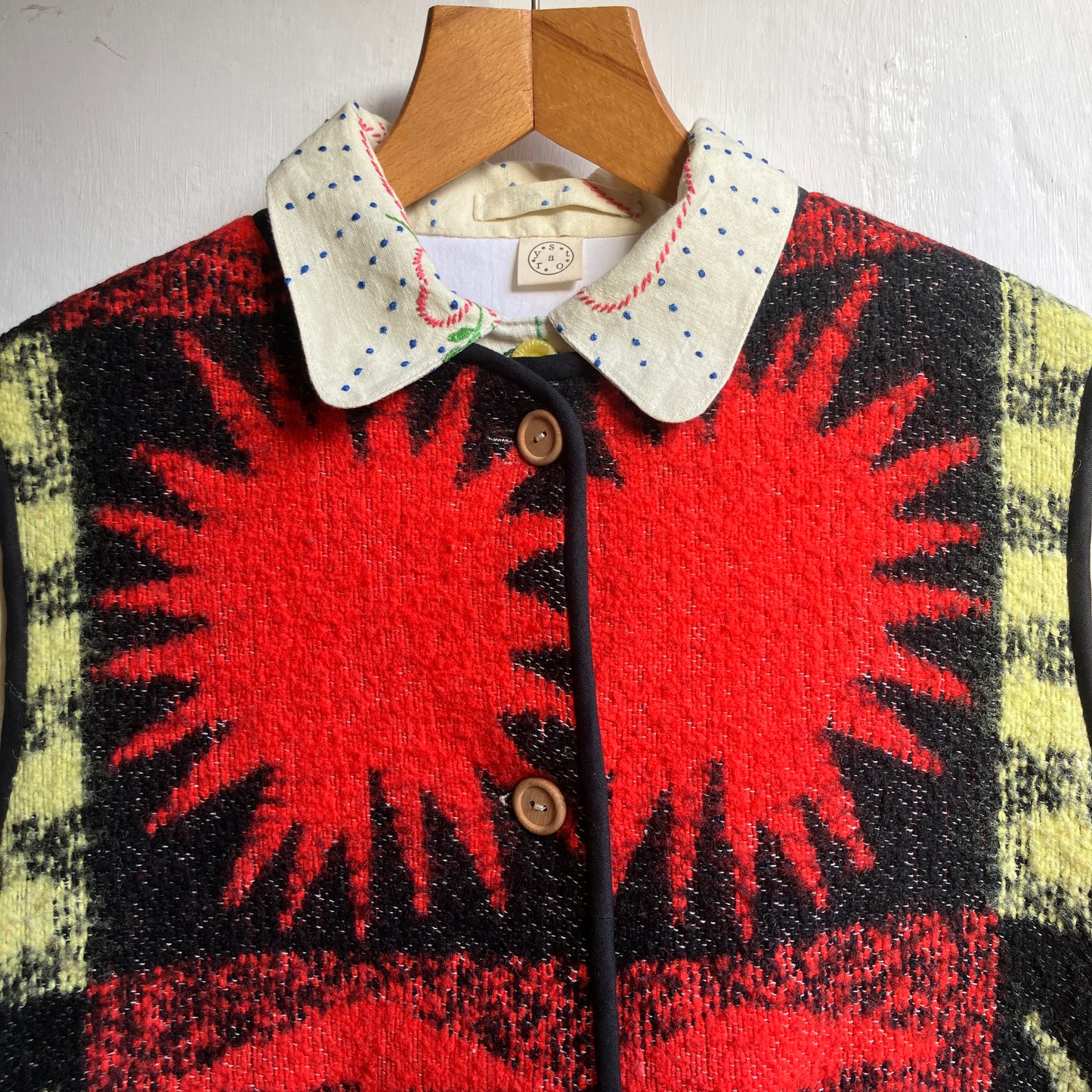 Wooly vest made from a recycled blanket with a star pattern