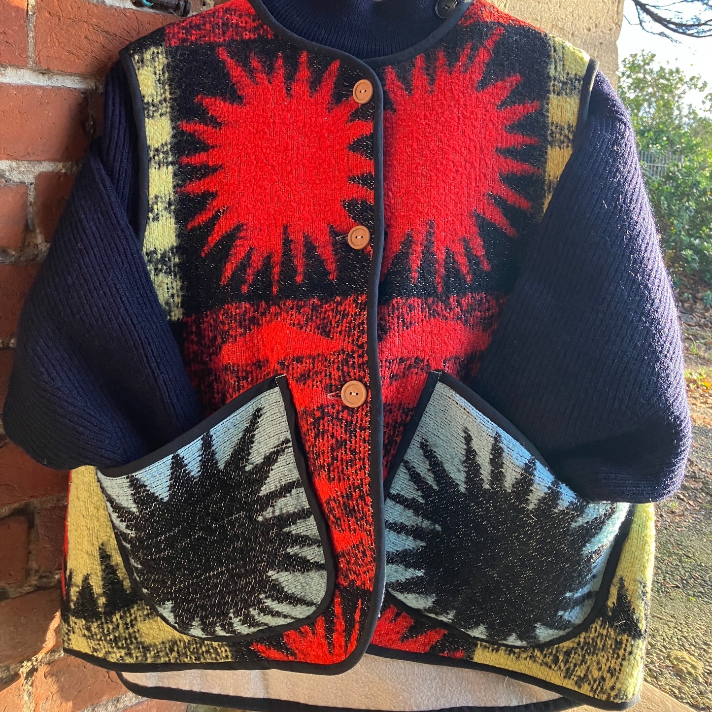 Wooly vest made from a recycled blanket with a star pattern