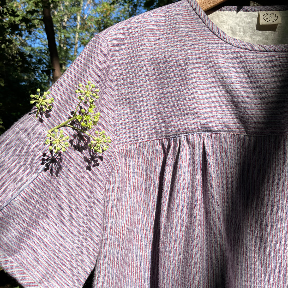 striped smock top with side buttons and three pockets