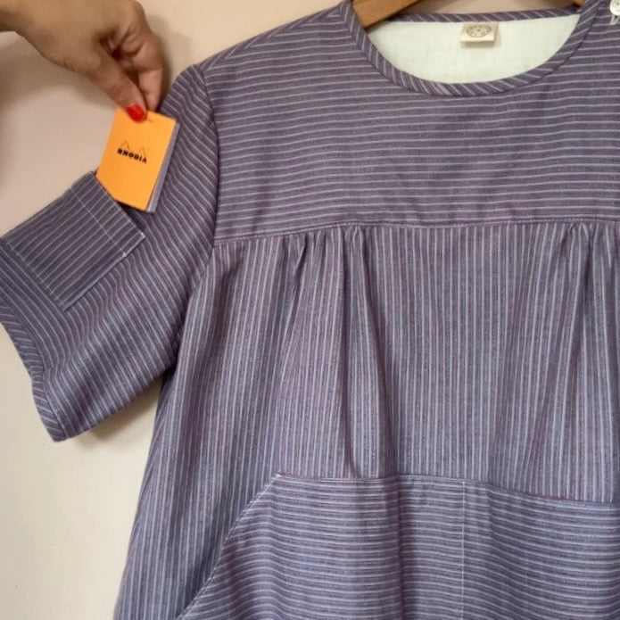 striped smock top with side buttons and three pockets