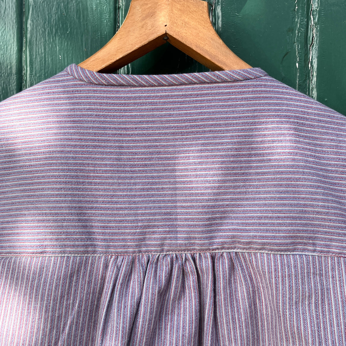 striped smock top with side buttons and three pockets