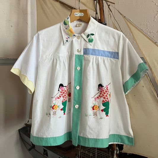 shirt made from reclaimed vintage pillowcases with two appliqué ladies