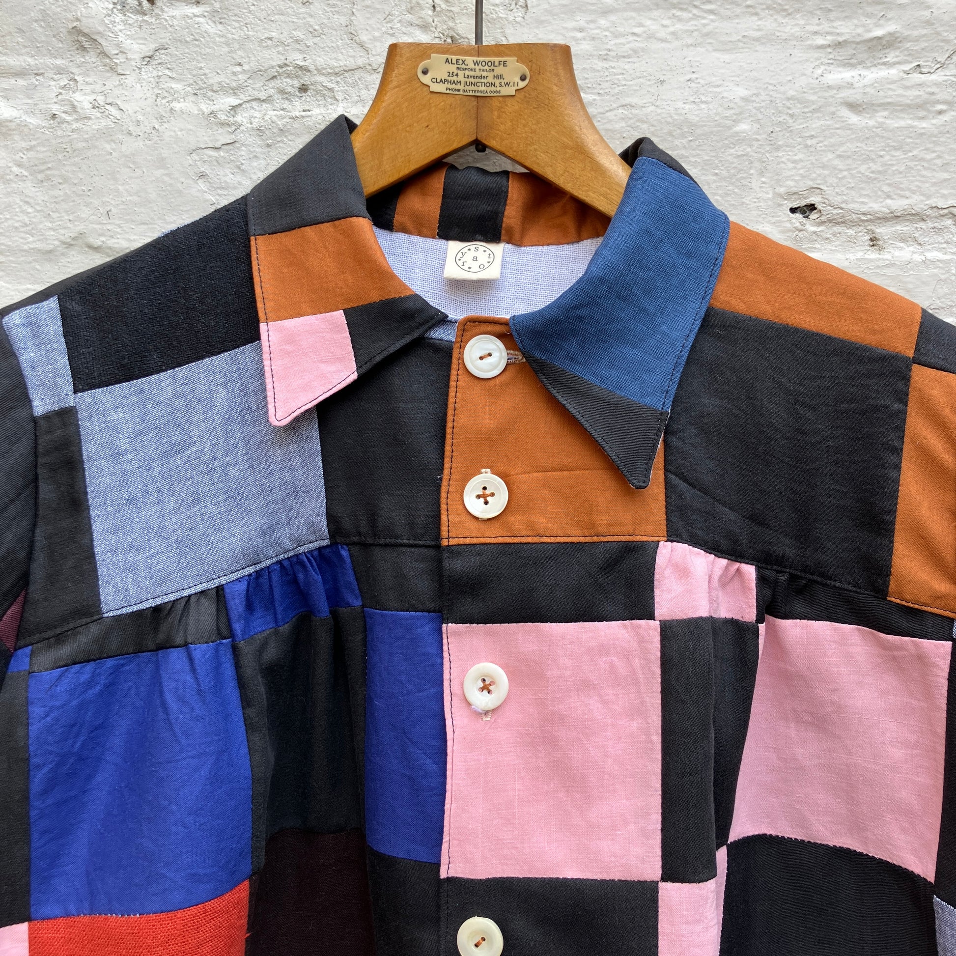 Shirt made from a patchwork of cotton and linen offcuts in black and muted brights.