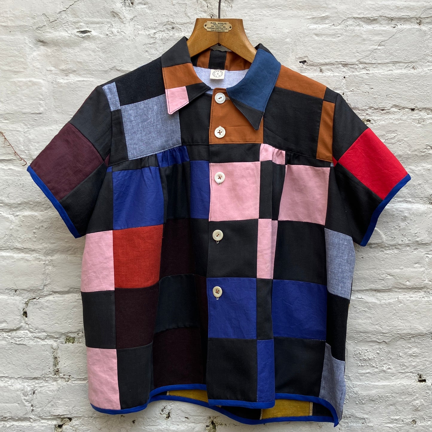 Shirt made from a patchwork of cotton and linen offcuts in black and muted brights.