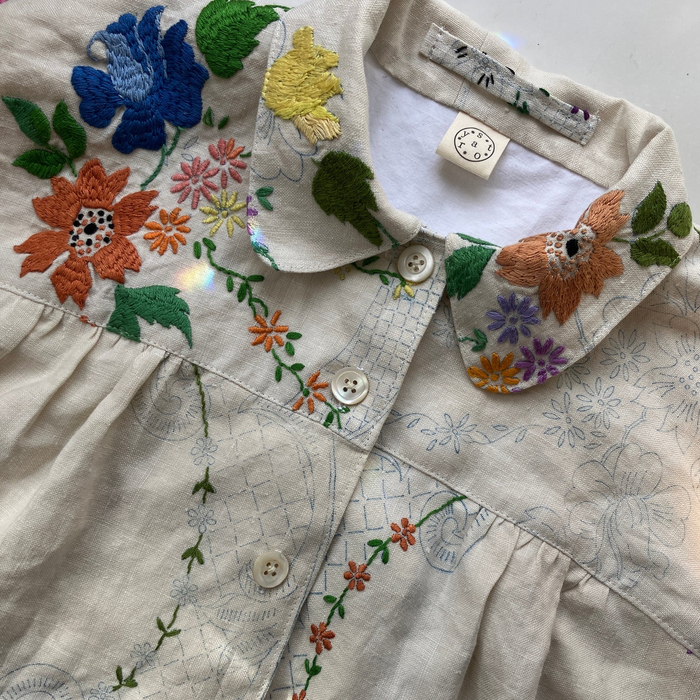 Blouse made from a recycled part-embroidered vintage linen tablecloth