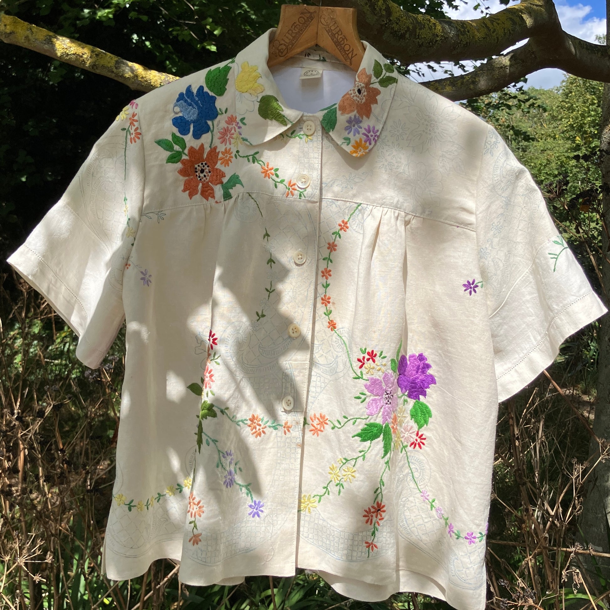 Blouse made from a recycled part-embroidered vintage linen tablecloth