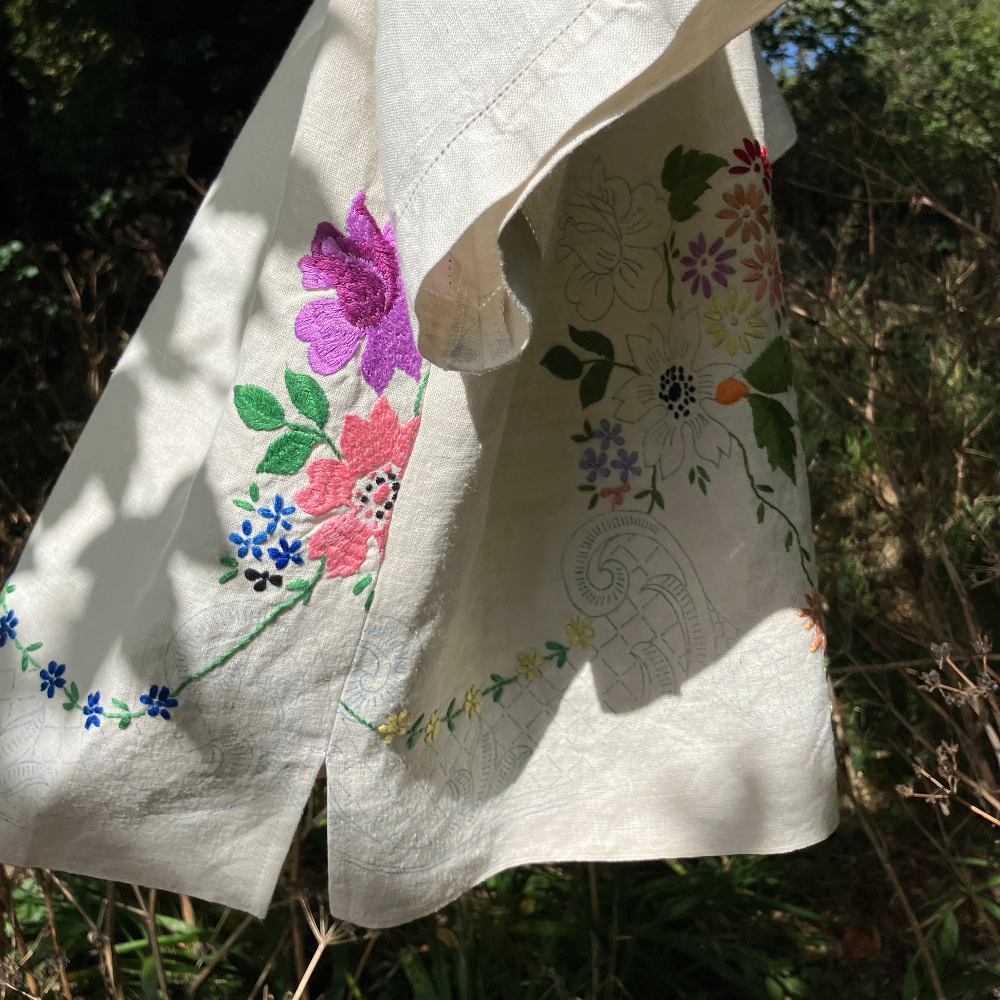 Blouse made from a recycled part-embroidered vintage linen tablecloth