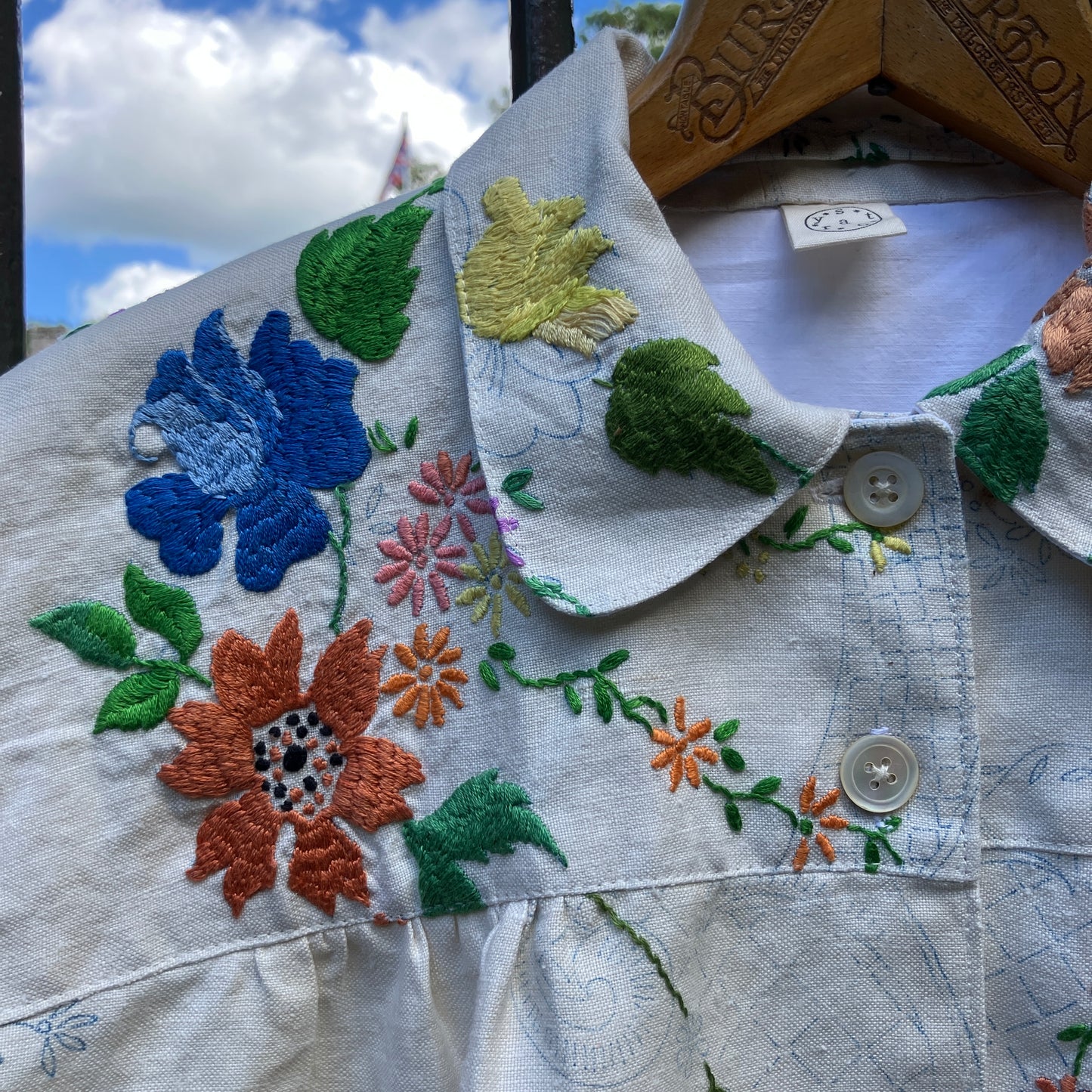 Blouse made from a recycled part-embroidered vintage linen tablecloth