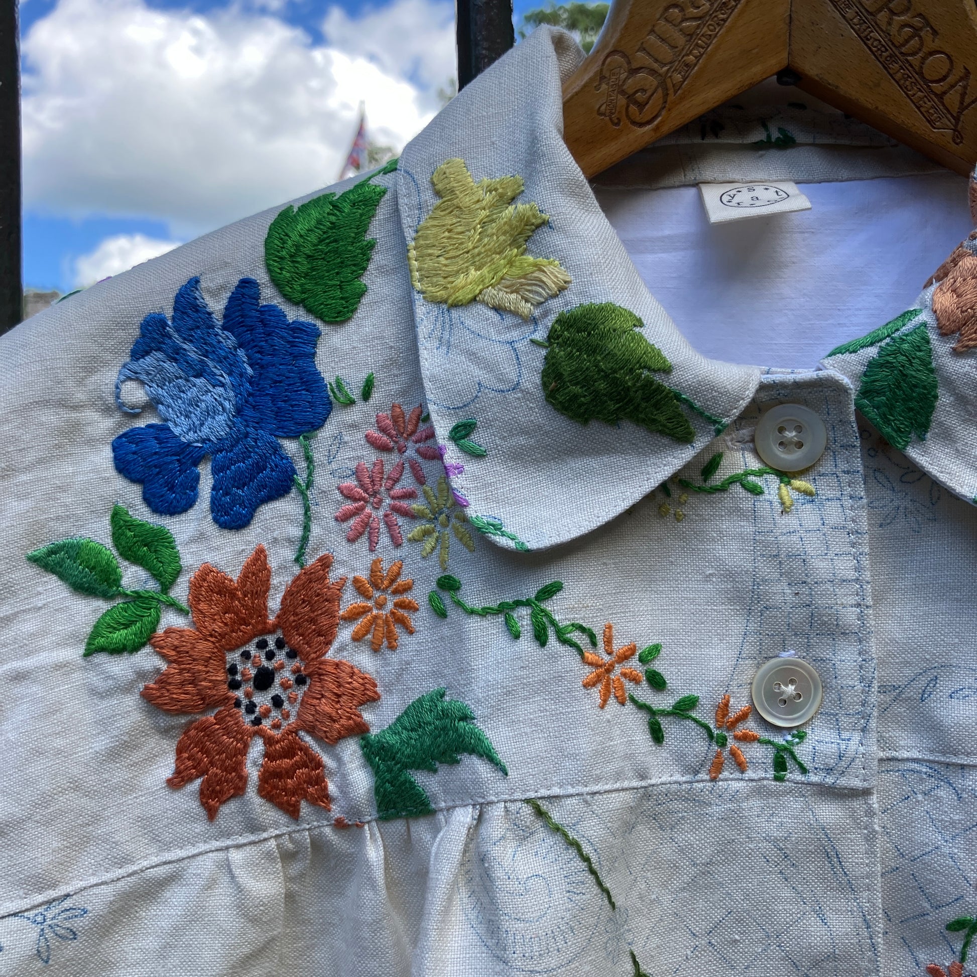 Blouse made from a recycled part-embroidered vintage linen tablecloth