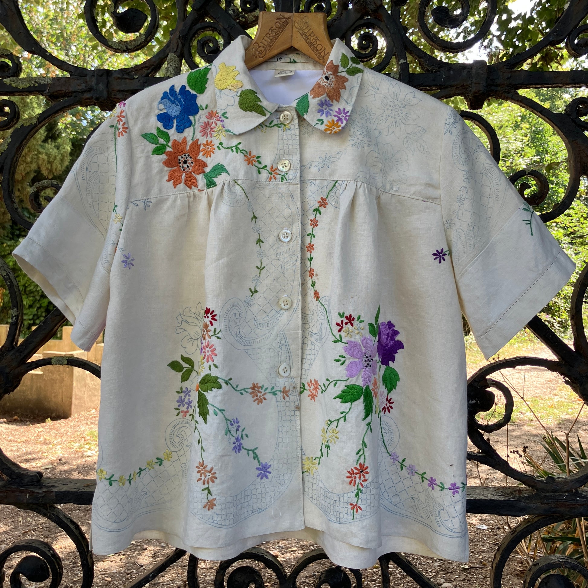 Blouse made from a recycled part-embroidered vintage linen tablecloth