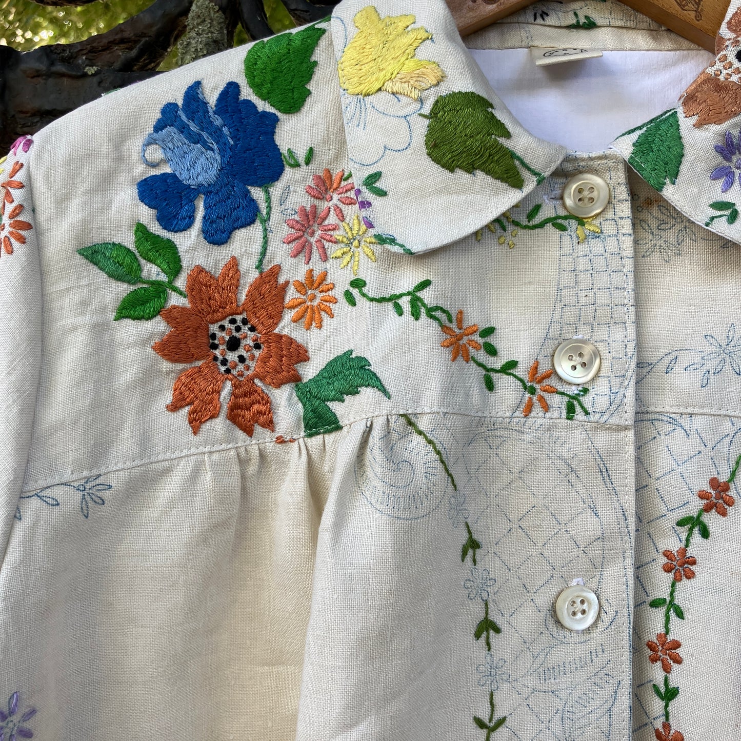 Blouse made from a recycled part-embroidered vintage linen tablecloth