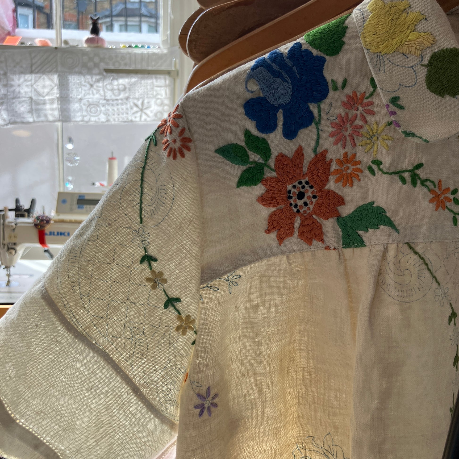 Blouse made from a recycled part-embroidered vintage linen tablecloth