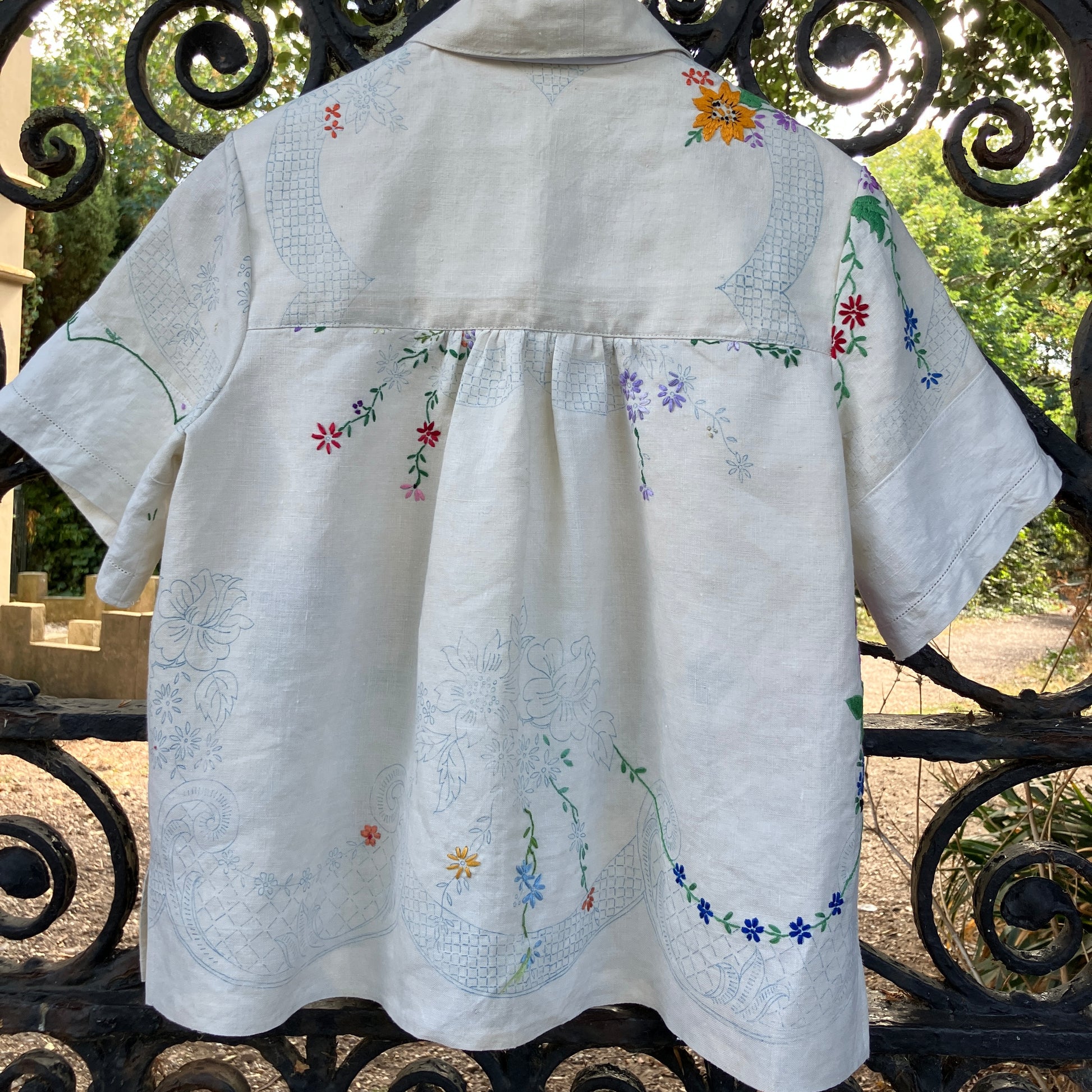 Blouse made from a recycled part-embroidered vintage linen tablecloth