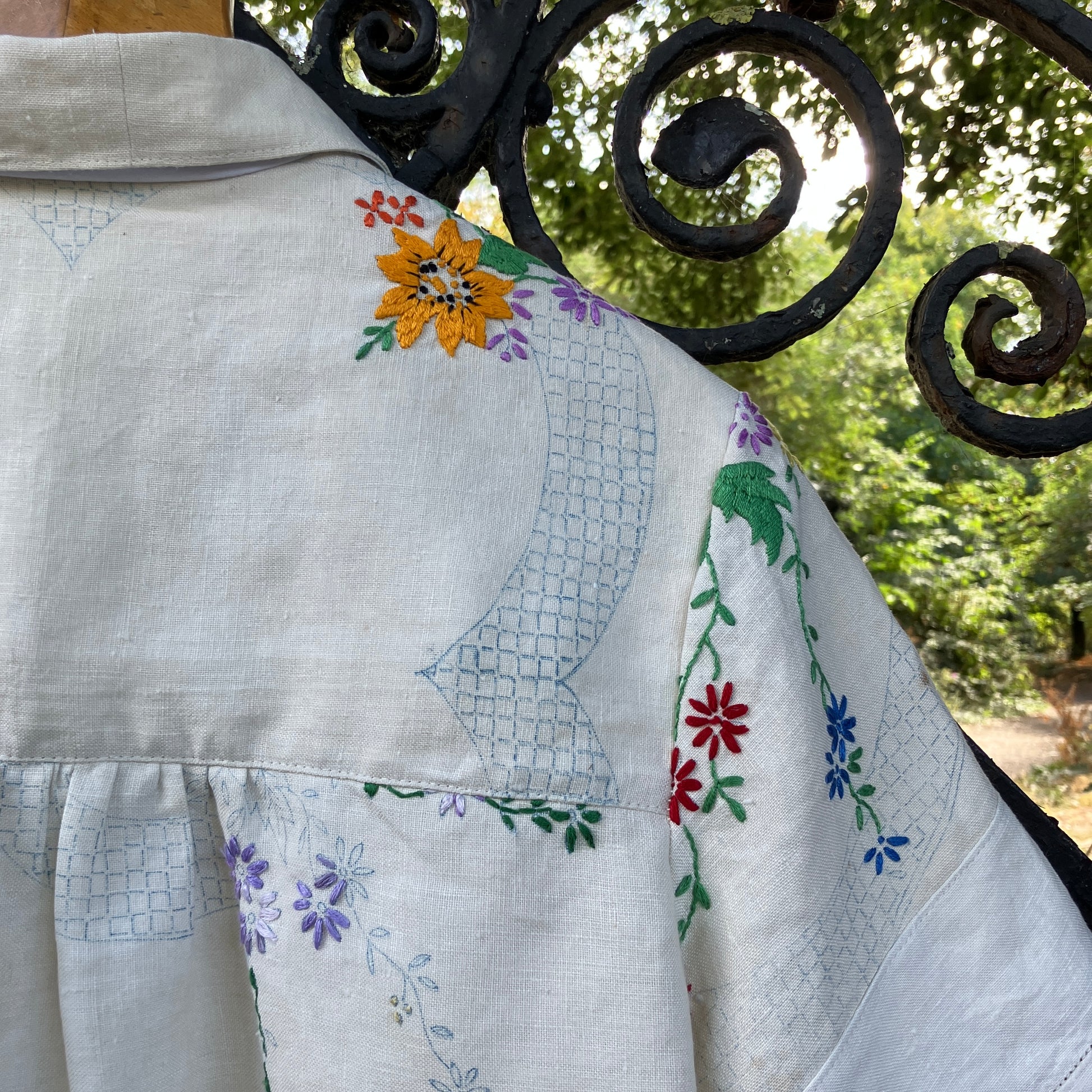 Blouse made from a recycled part-embroidered vintage linen tablecloth