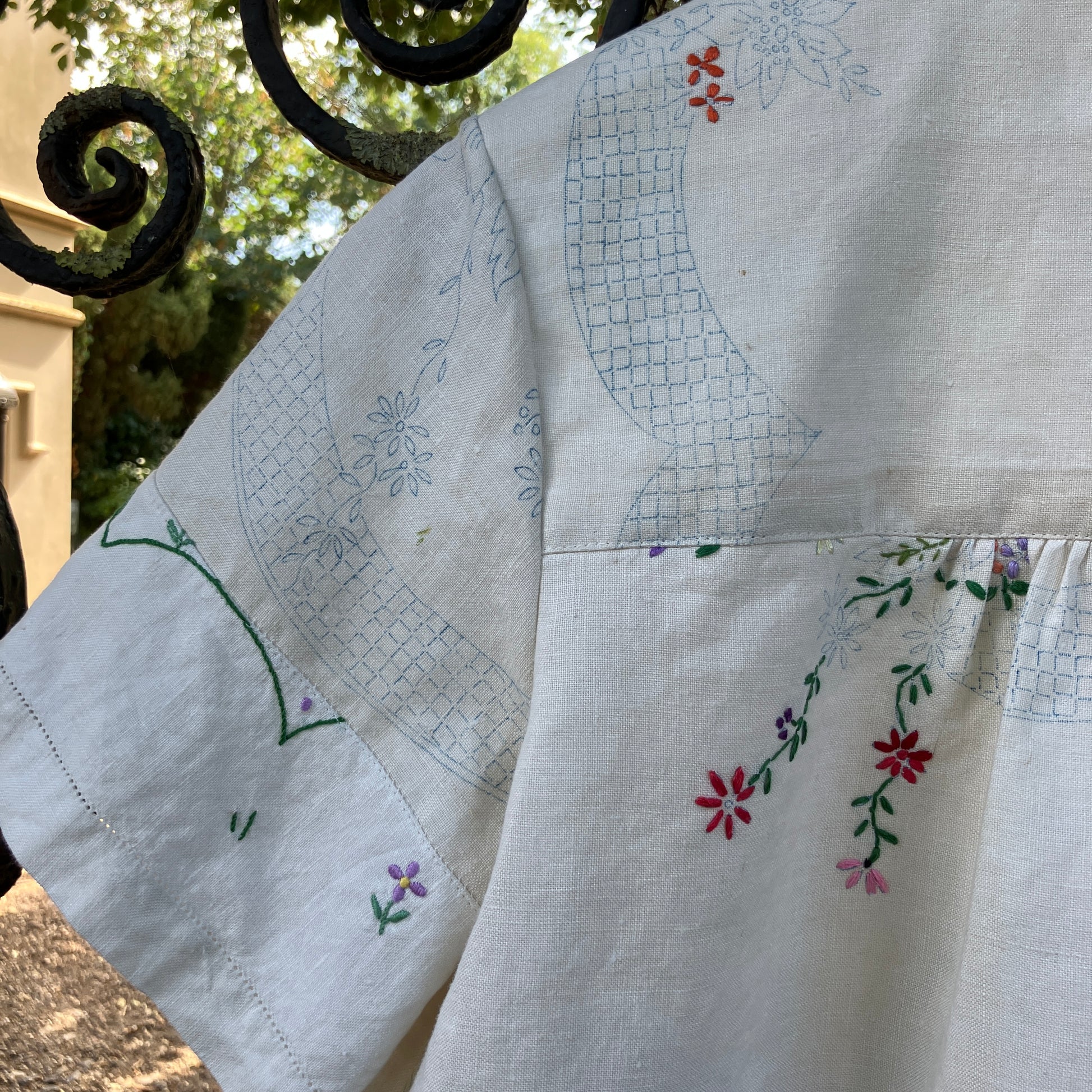 Blouse made from a recycled part-embroidered vintage linen tablecloth