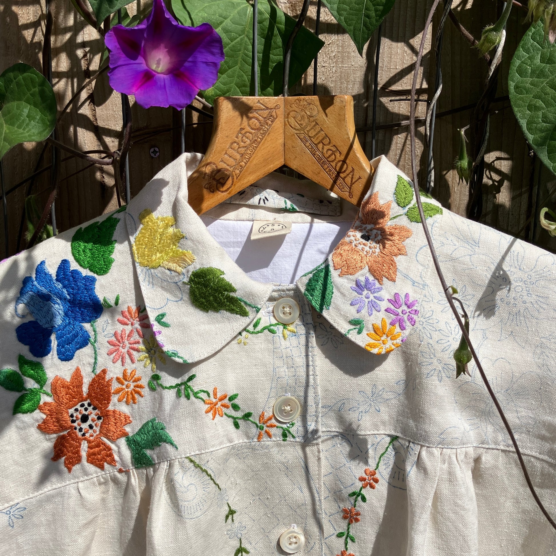 Blouse made from a recycled part-embroidered vintage linen tablecloth