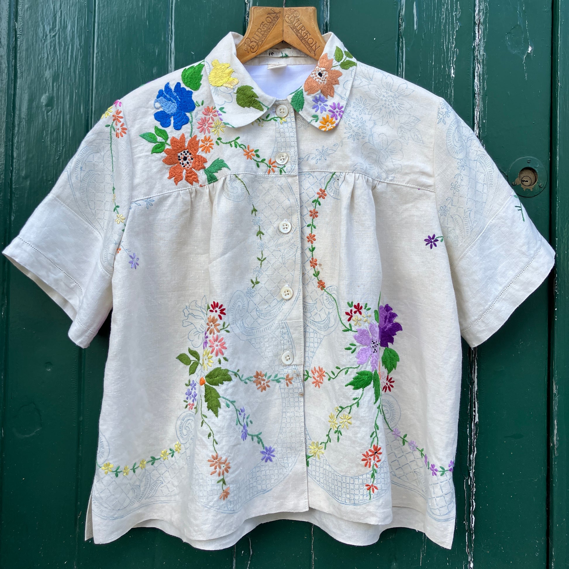 Blouse made from a recycled part-embroidered vintage linen tablecloth