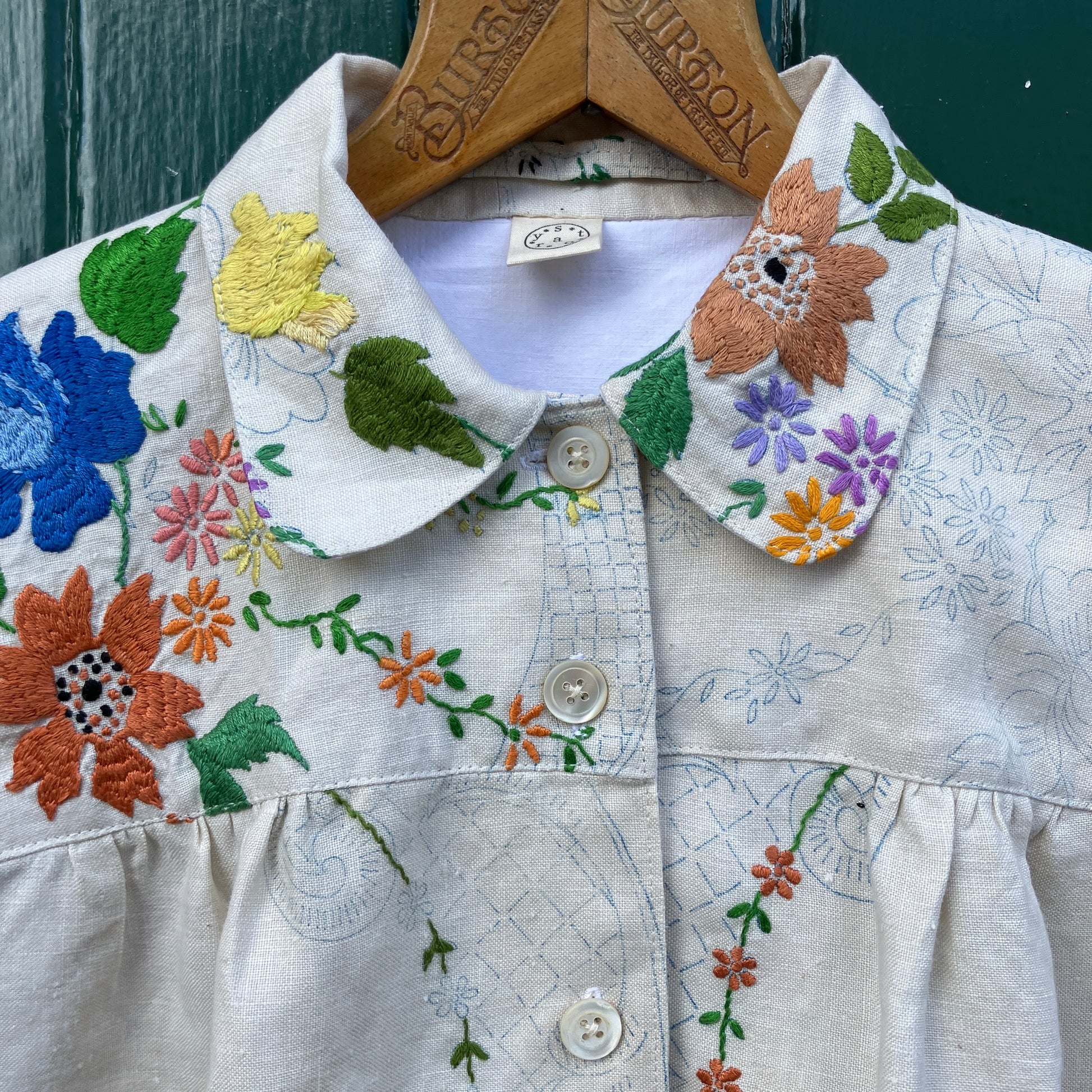 Blouse made from a recycled part-embroidered vintage linen tablecloth